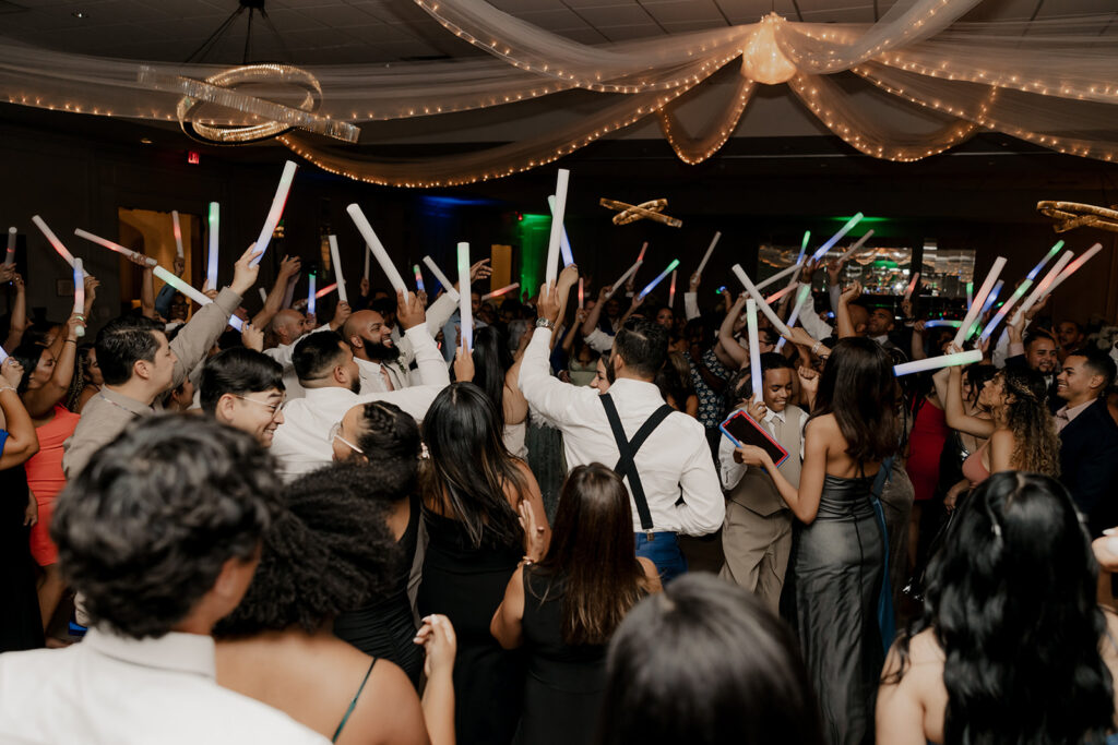 bride and groom dance with their wedding guests 