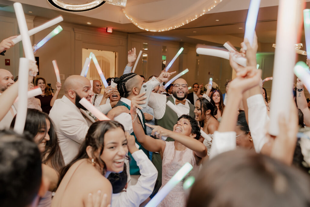 bride and groom dance with their wedding guests 