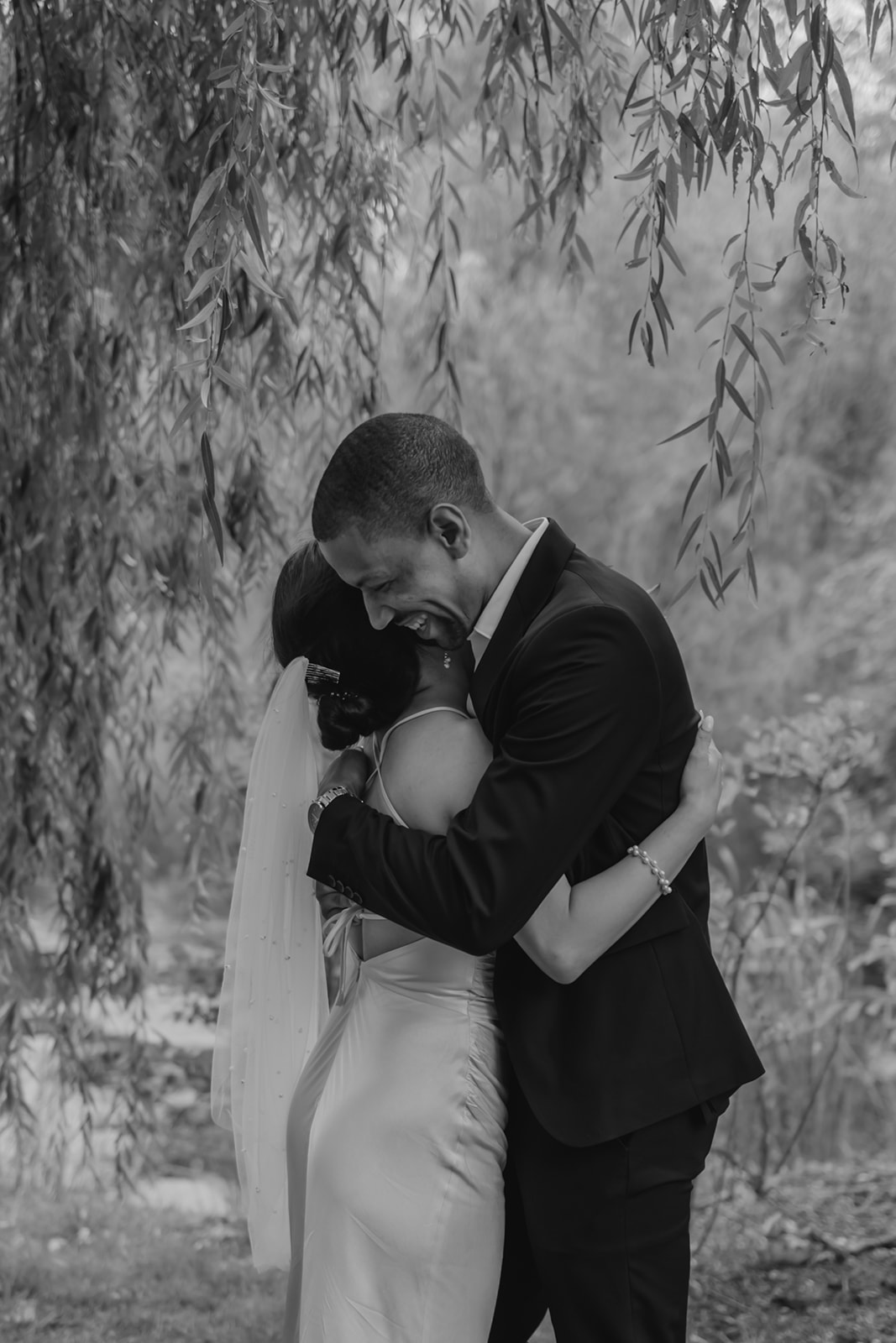 Stunning bride and groom share candid moments during their first look photos