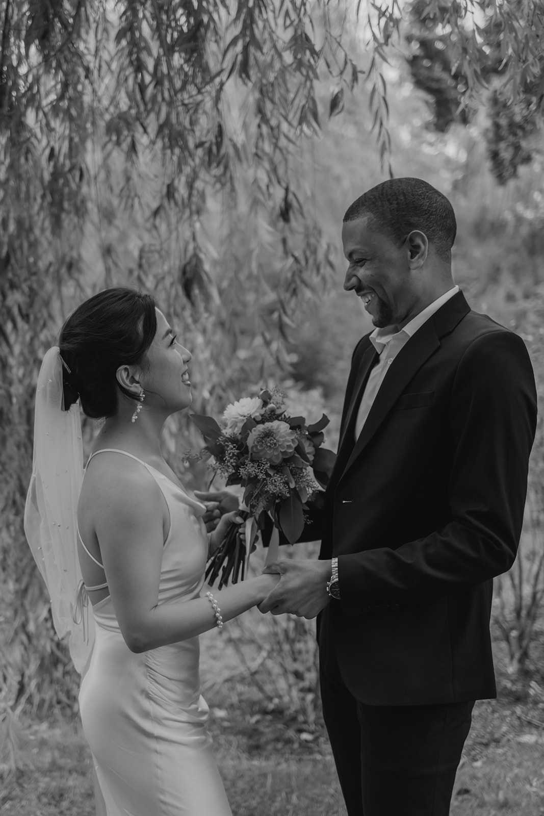 Stunning bride and groom share candid moments during their first look photos