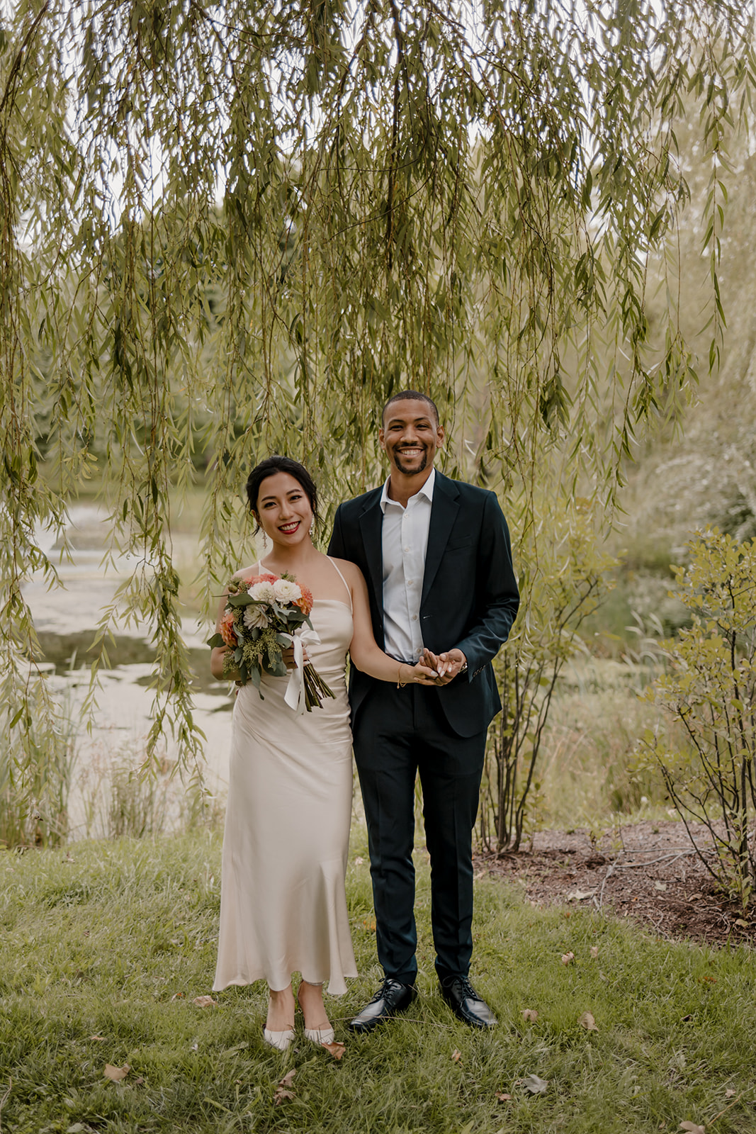 Stunning bride and groom pose together in the garden after their dreamy Boston elopement