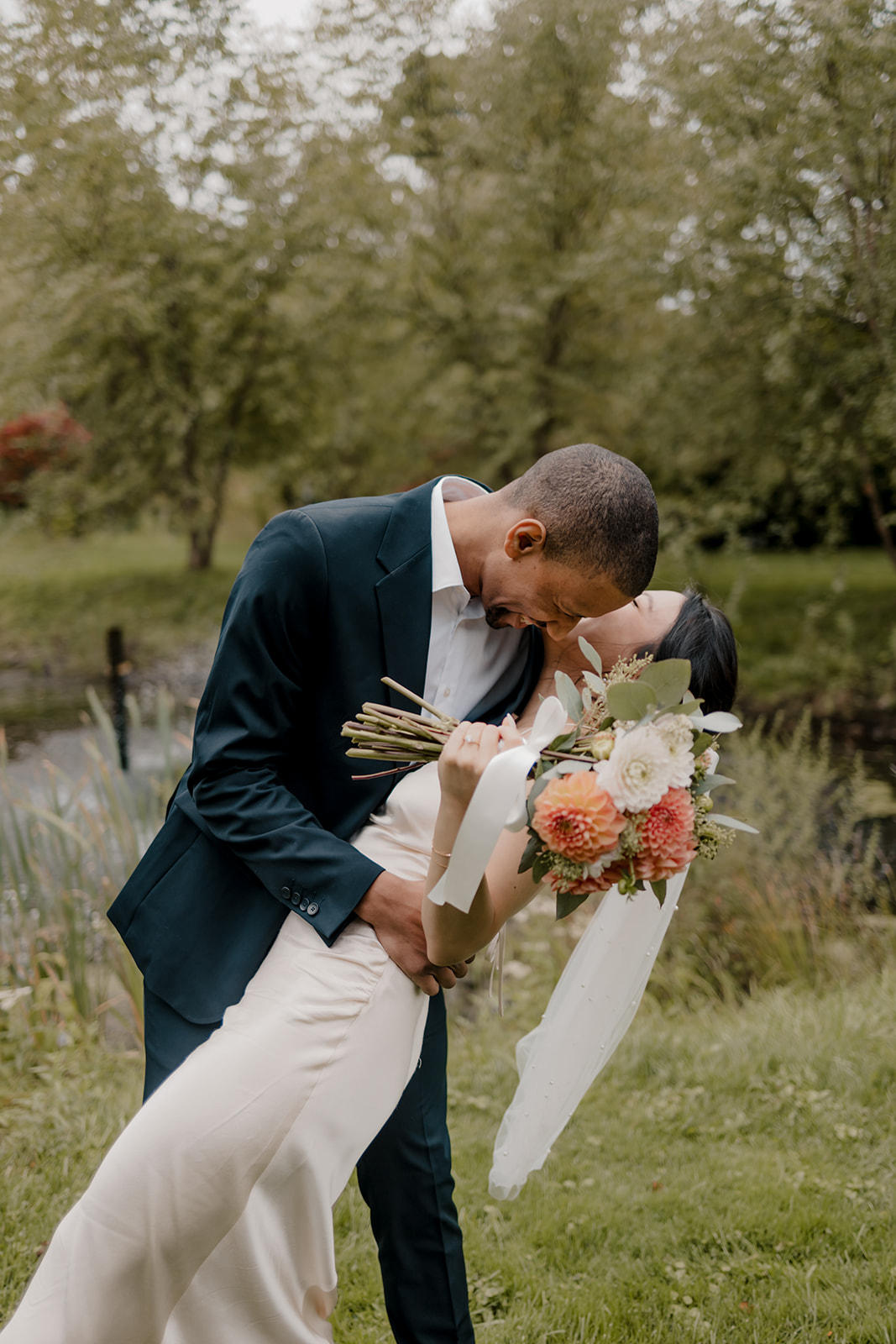 Stunning bride and groom pose together in the garden after their dreamy Boston elopement