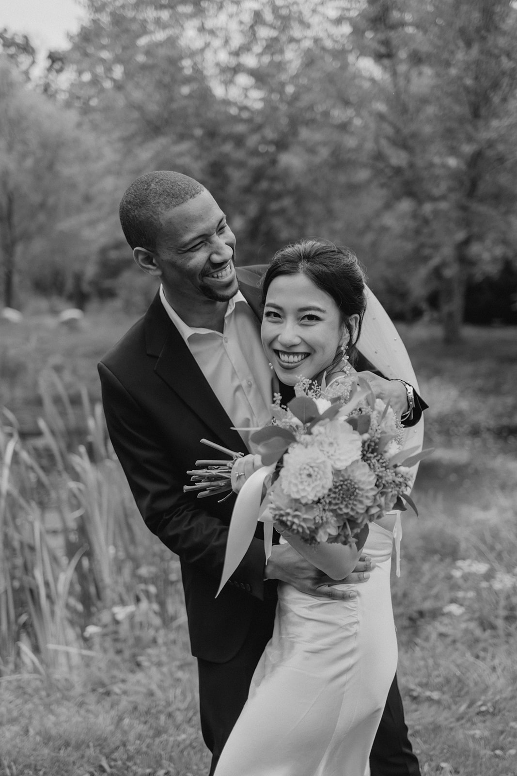 Stunning bride and groom pose together in the garden after their dreamy Boston elopement