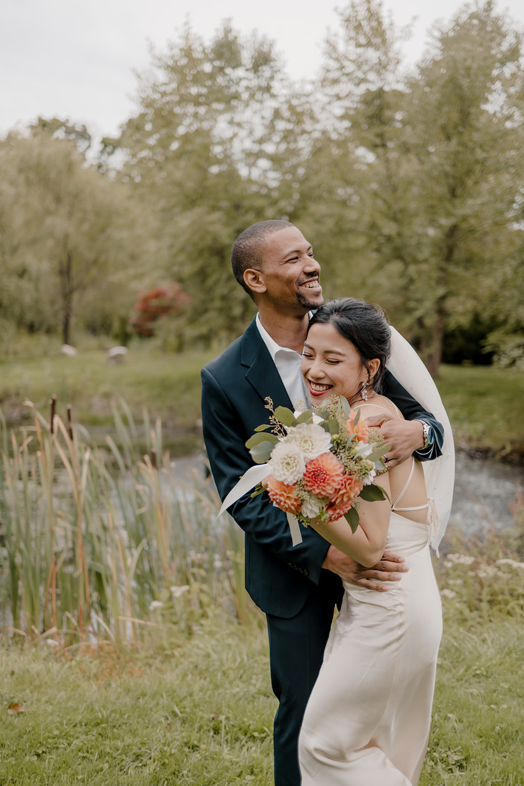 Stunning bride and groom pose together in the garden after their dreamy Boston elopement