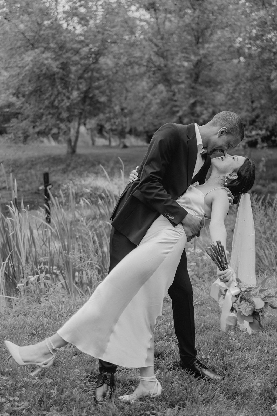 Stunning bride and groom pose together in the garden after their dreamy Boston elopement