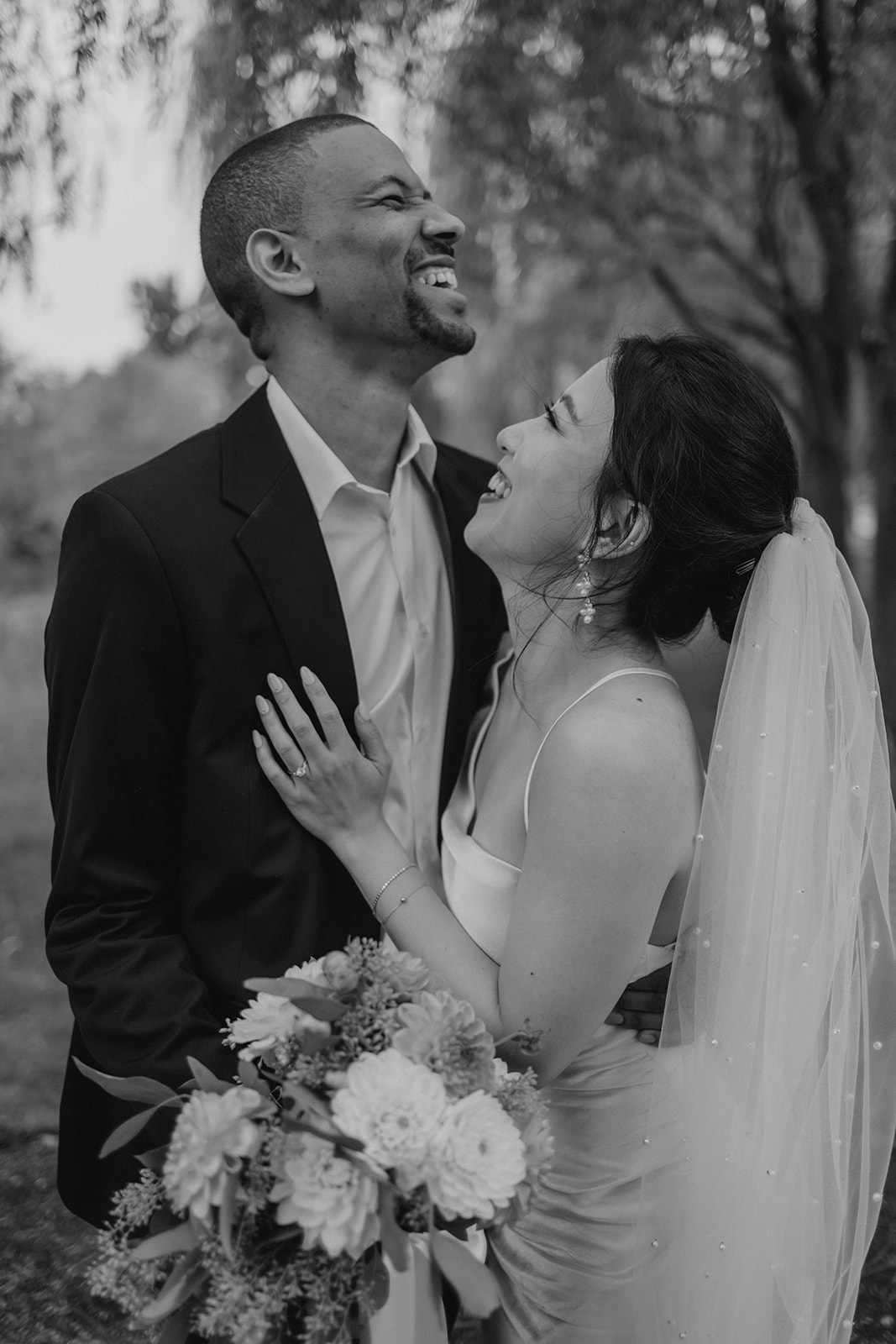 Stunning bride and groom pose together in the garden after their dreamy Boston elopement