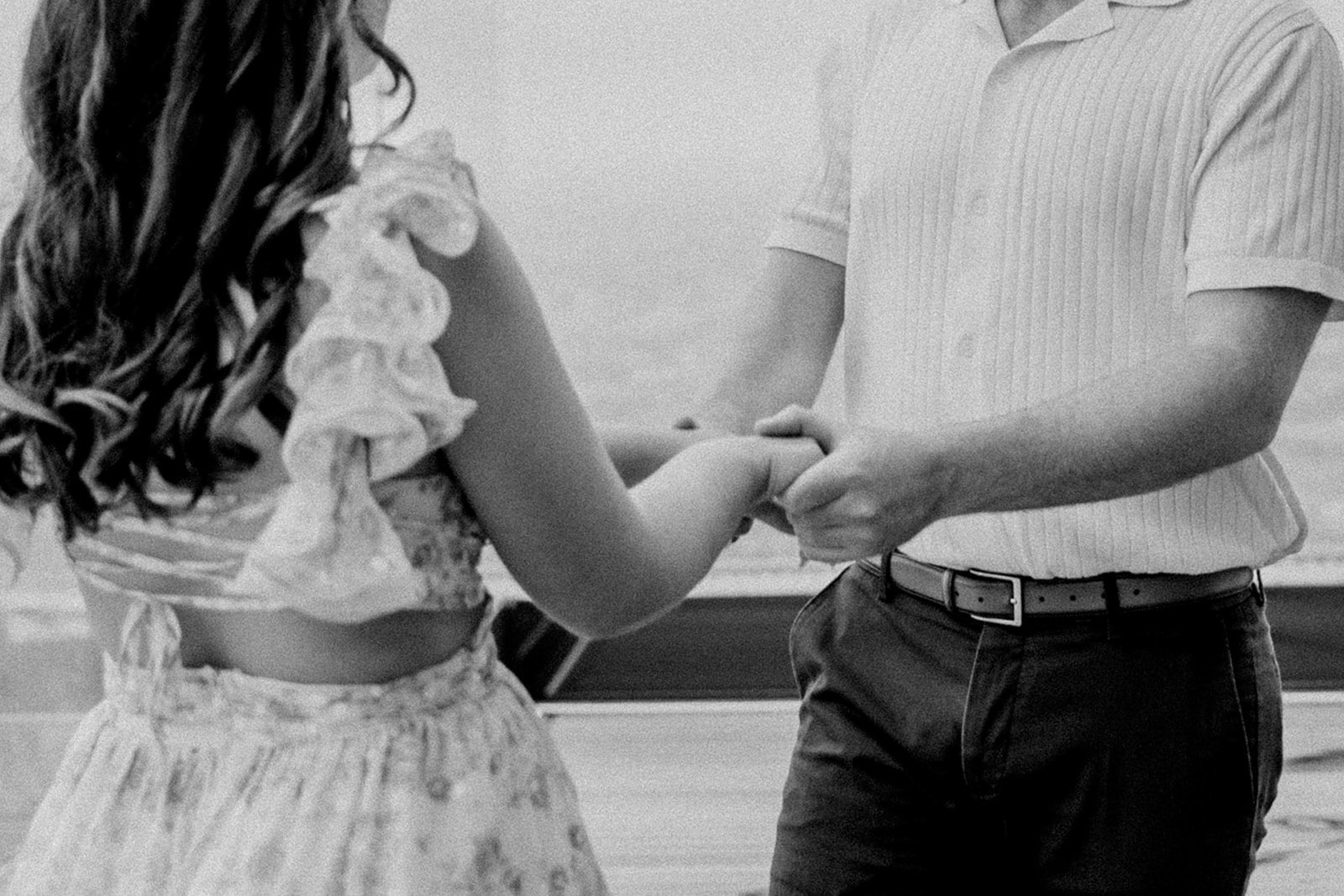 detail shot of a couple holding hands during their dreamy Boston engagement photos 