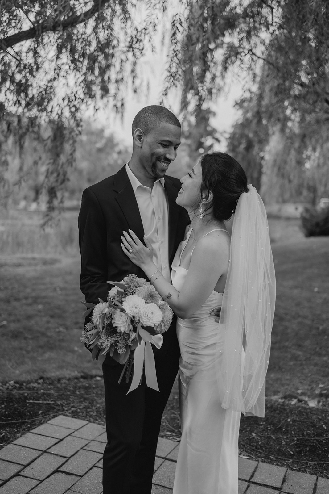 Stunning bride and groom pose together in the garden after their dreamy Boston elopement