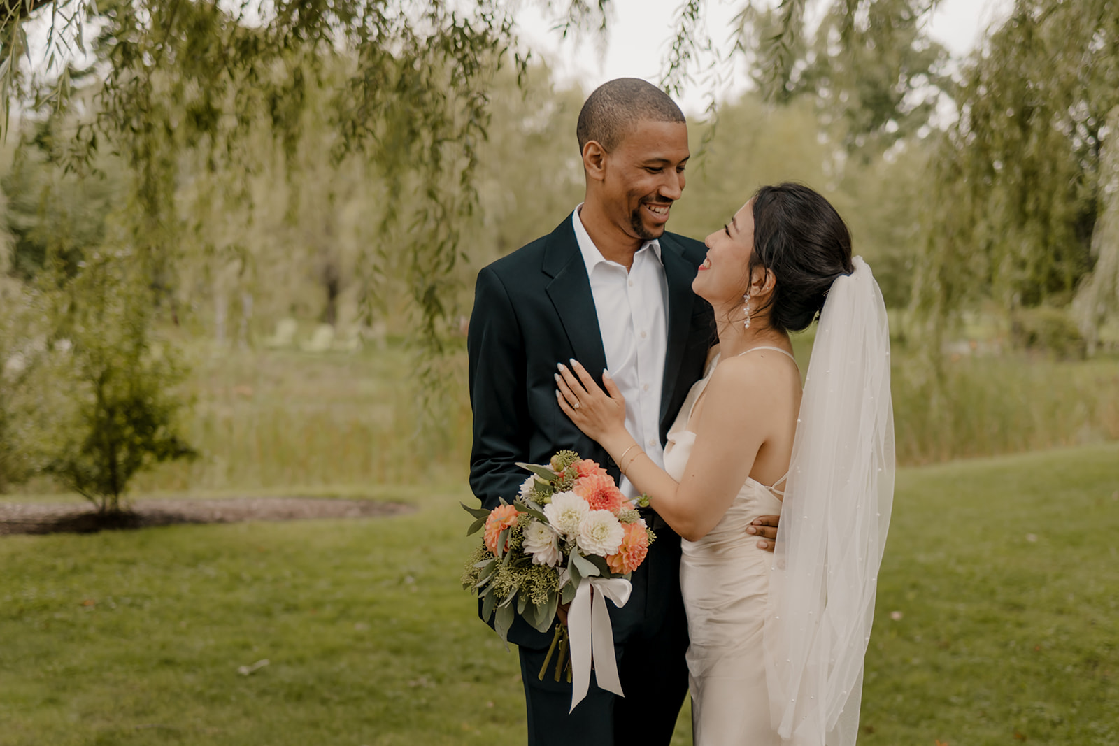 Stunning bride and groom pose together in the garden after their dreamy Boston elopement