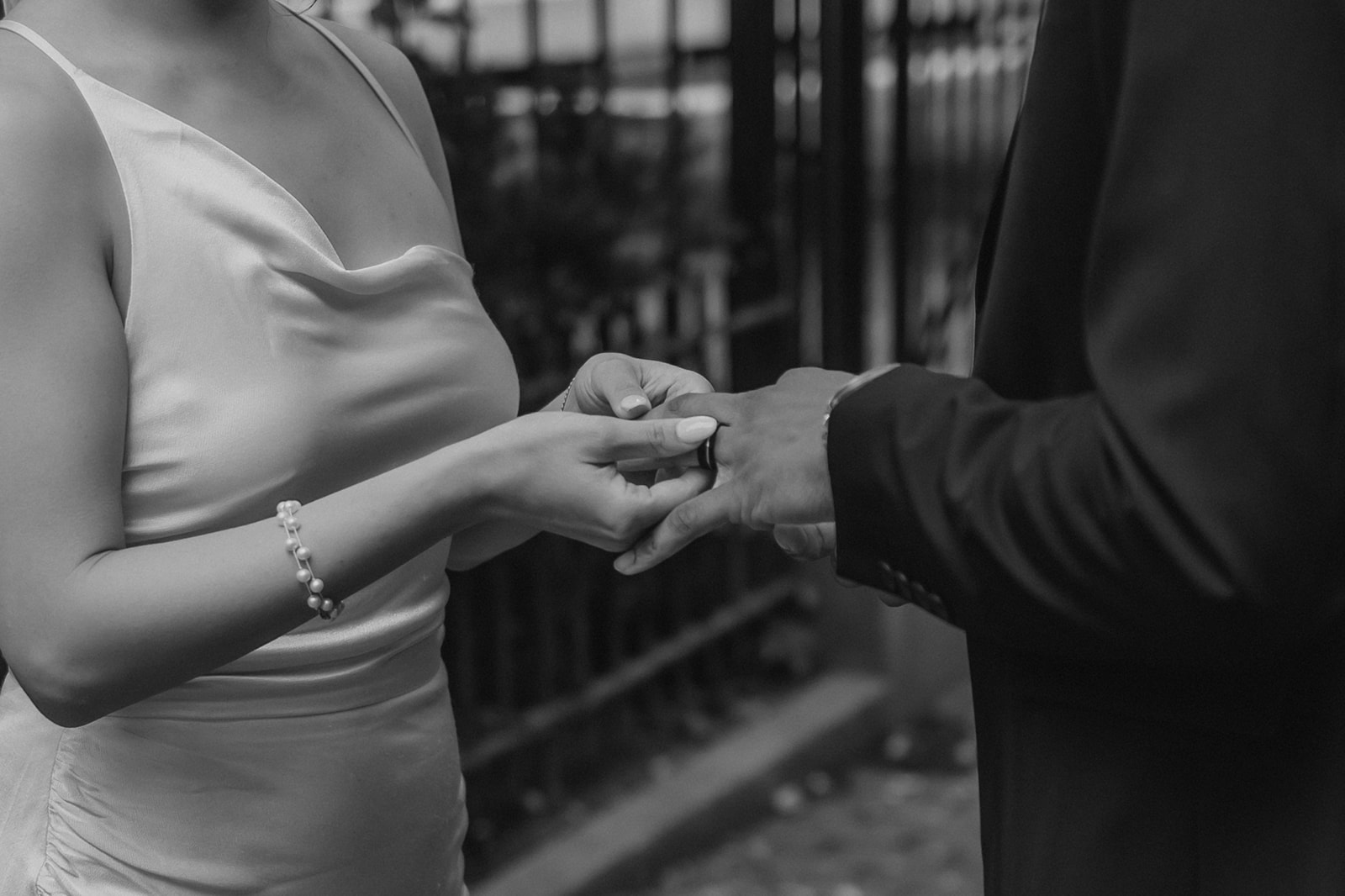 detail shot of a new couple holding hands