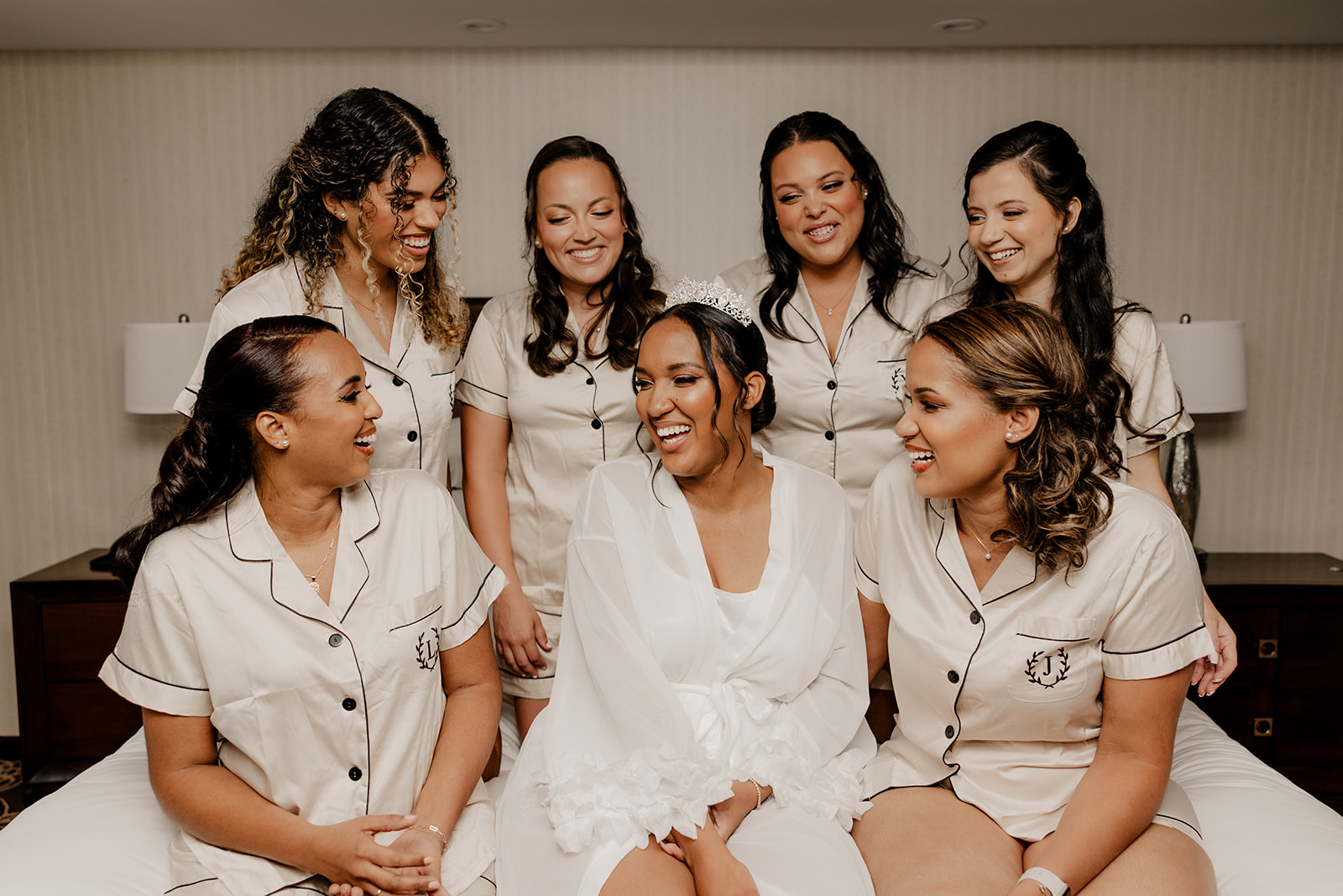 bridesmaids pose with the stunning bride on her wedding day