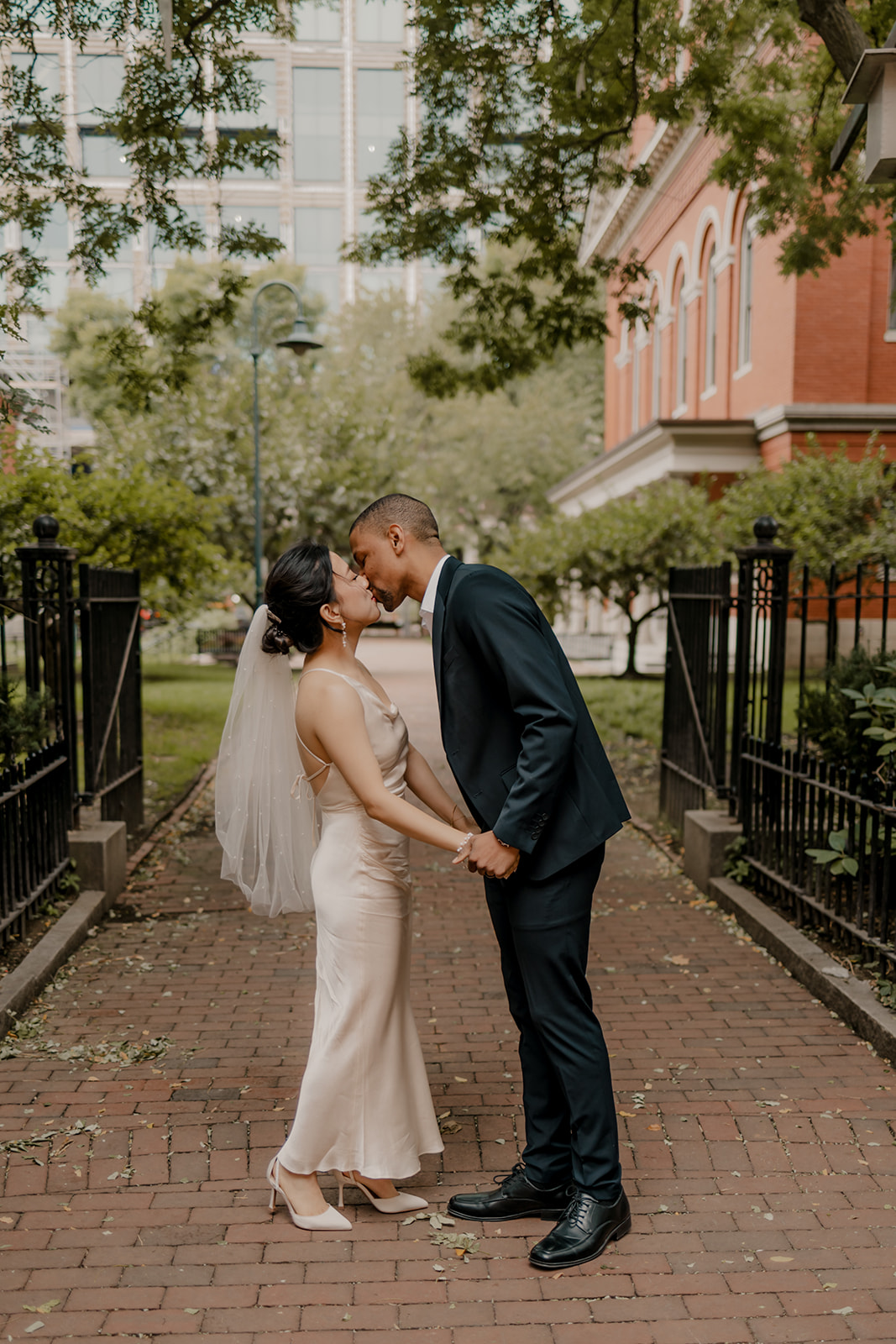 couple share a kiss after their Cambridge elopement