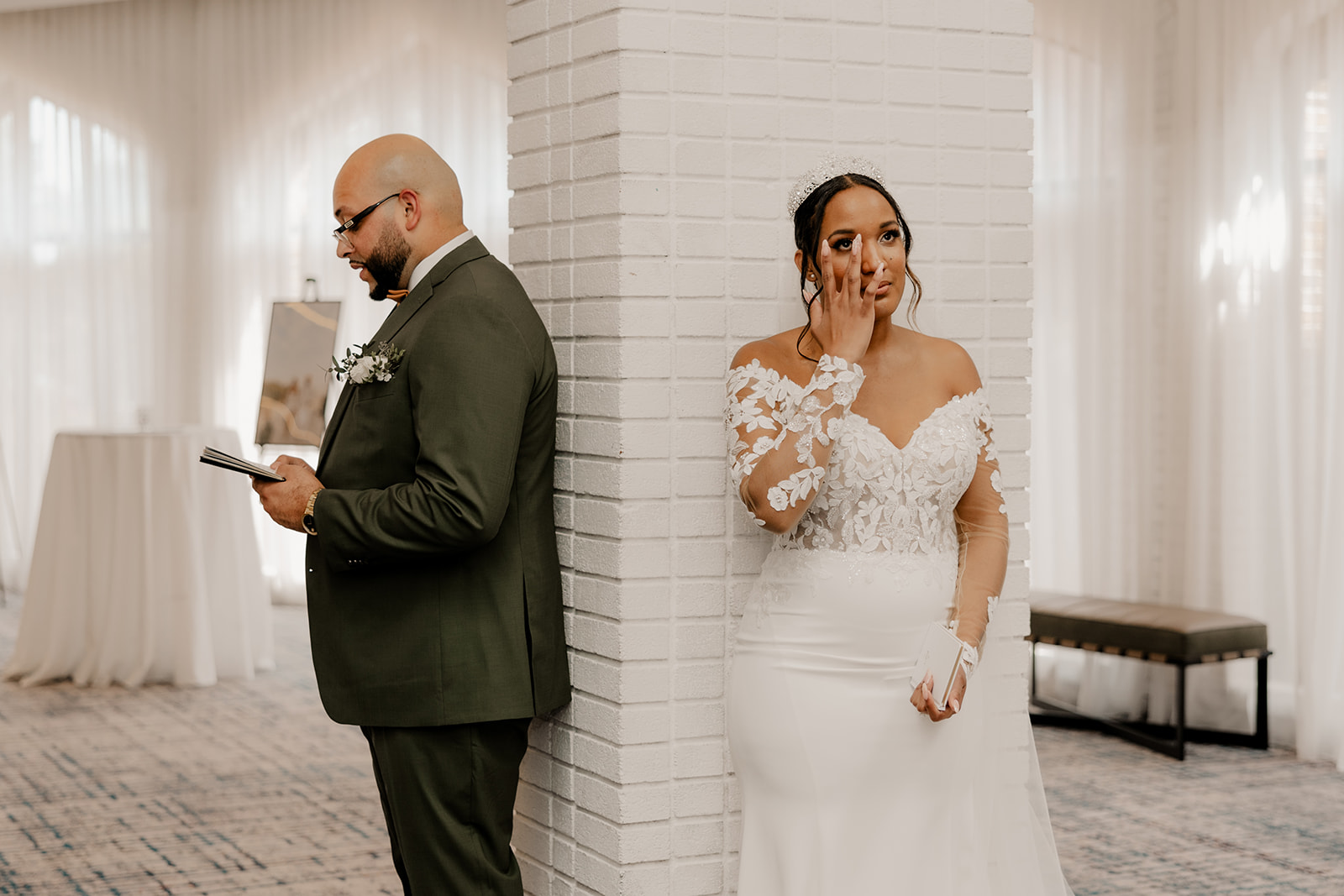 beautiful couple do a private vow and first touch ceremony around a corner 