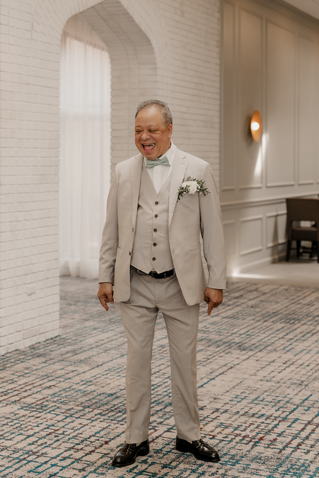 father reacts to his stunning daughter during their first look wedding photos