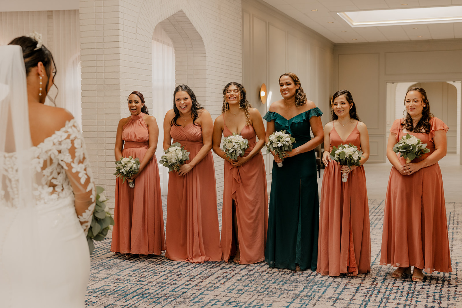 stunning bridesmaids react to a first look from the beautiful bride