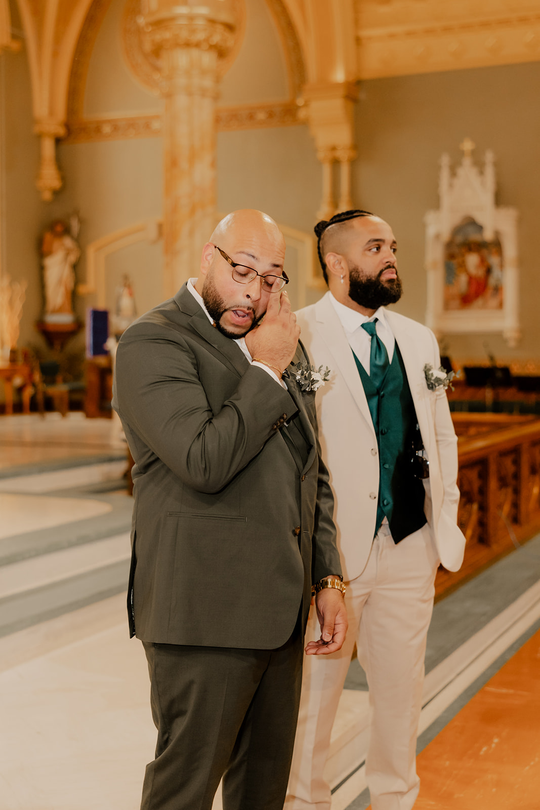 groom sheds a tear as he sees his bride walk down the aisle 