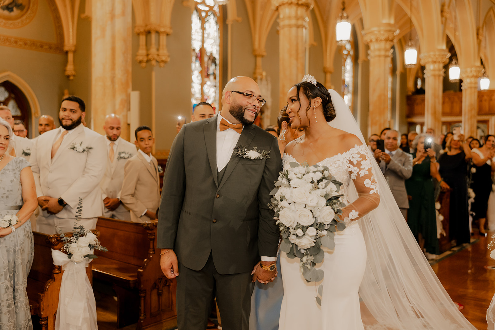 groom and bride talk as they enter the pulpit 