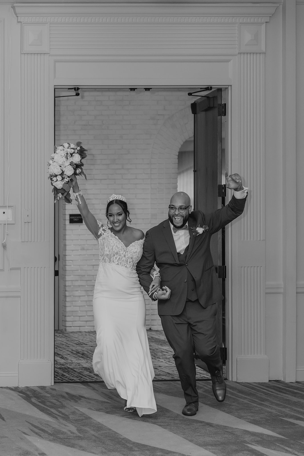 bride and groom enter their classy wedding reception 