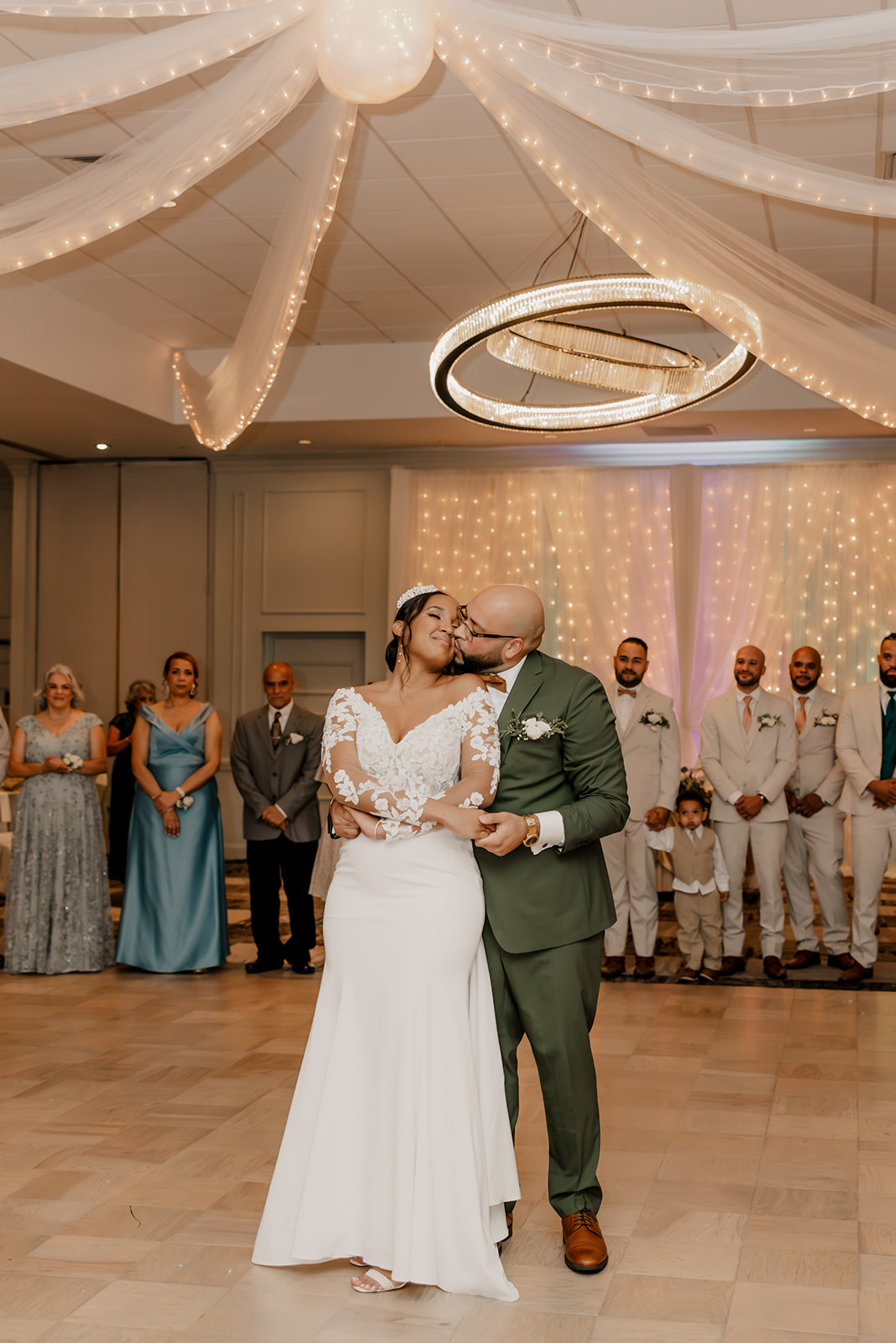 bride and groom share their first dance together 