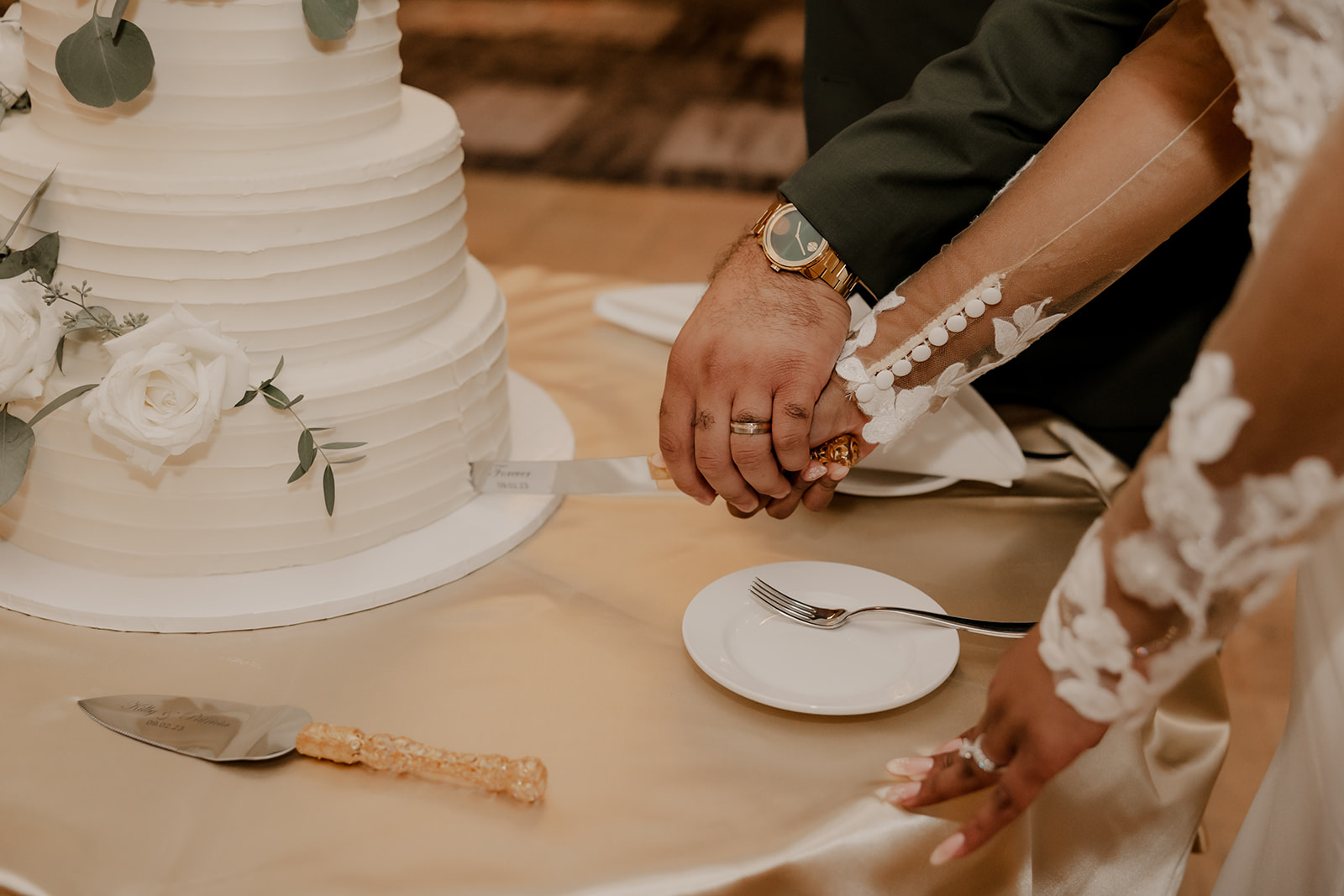 bride and groom cut their wedding cake together 