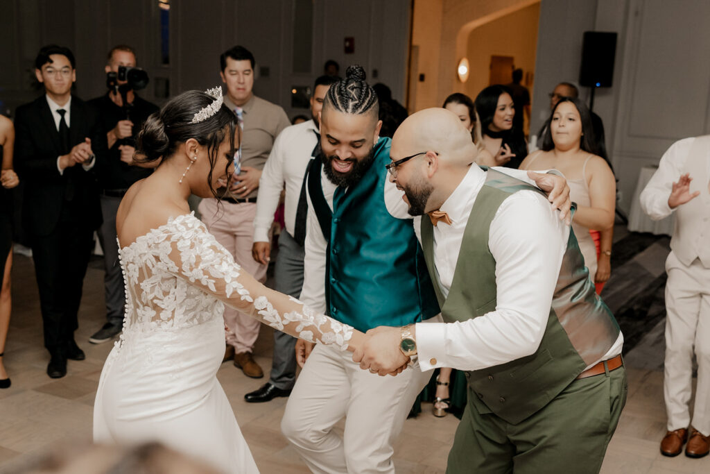 bride and groom dance with their wedding guests 