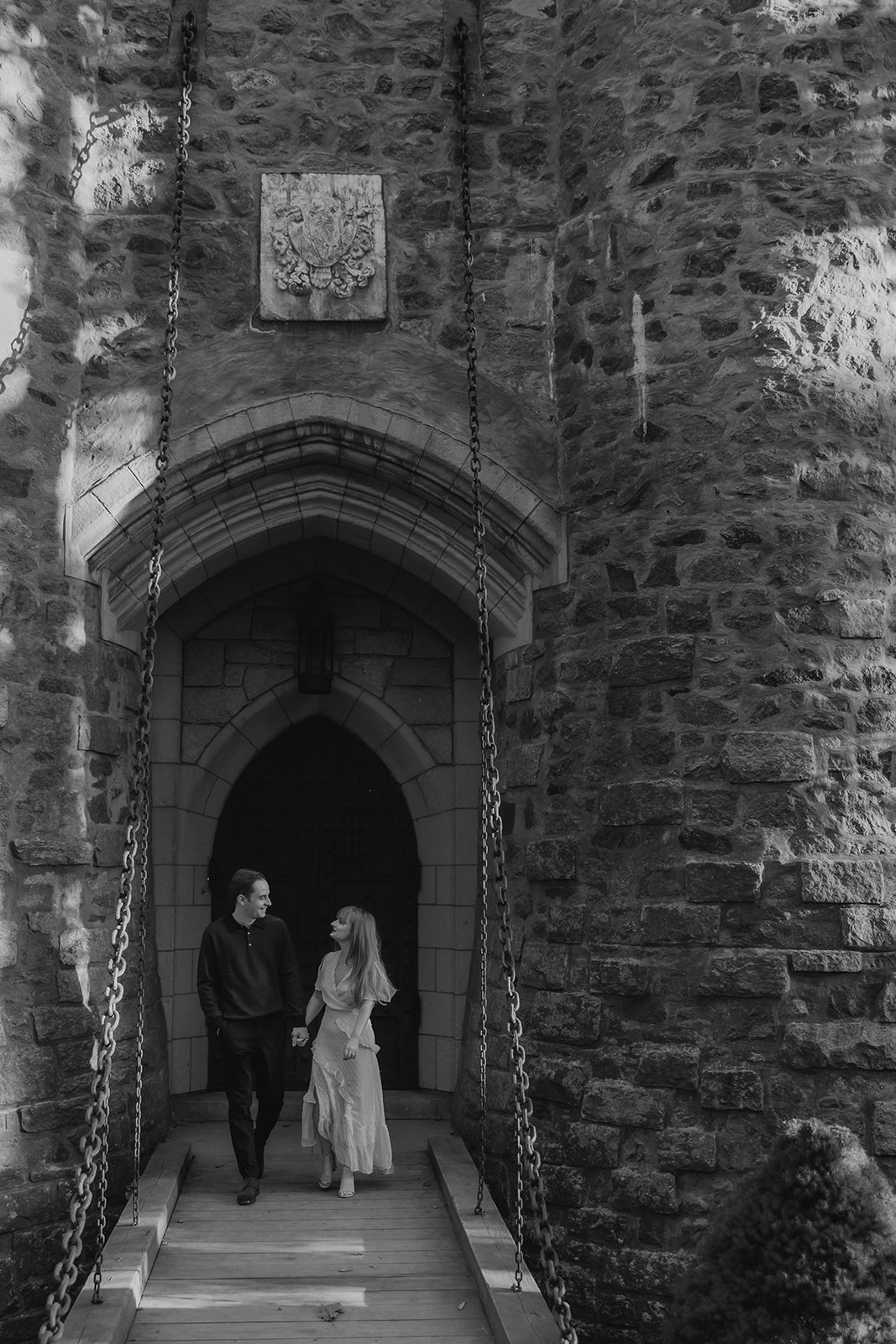 beautiful couple pose outside the Hammond castle during their Massachusetts engagement photoshoot