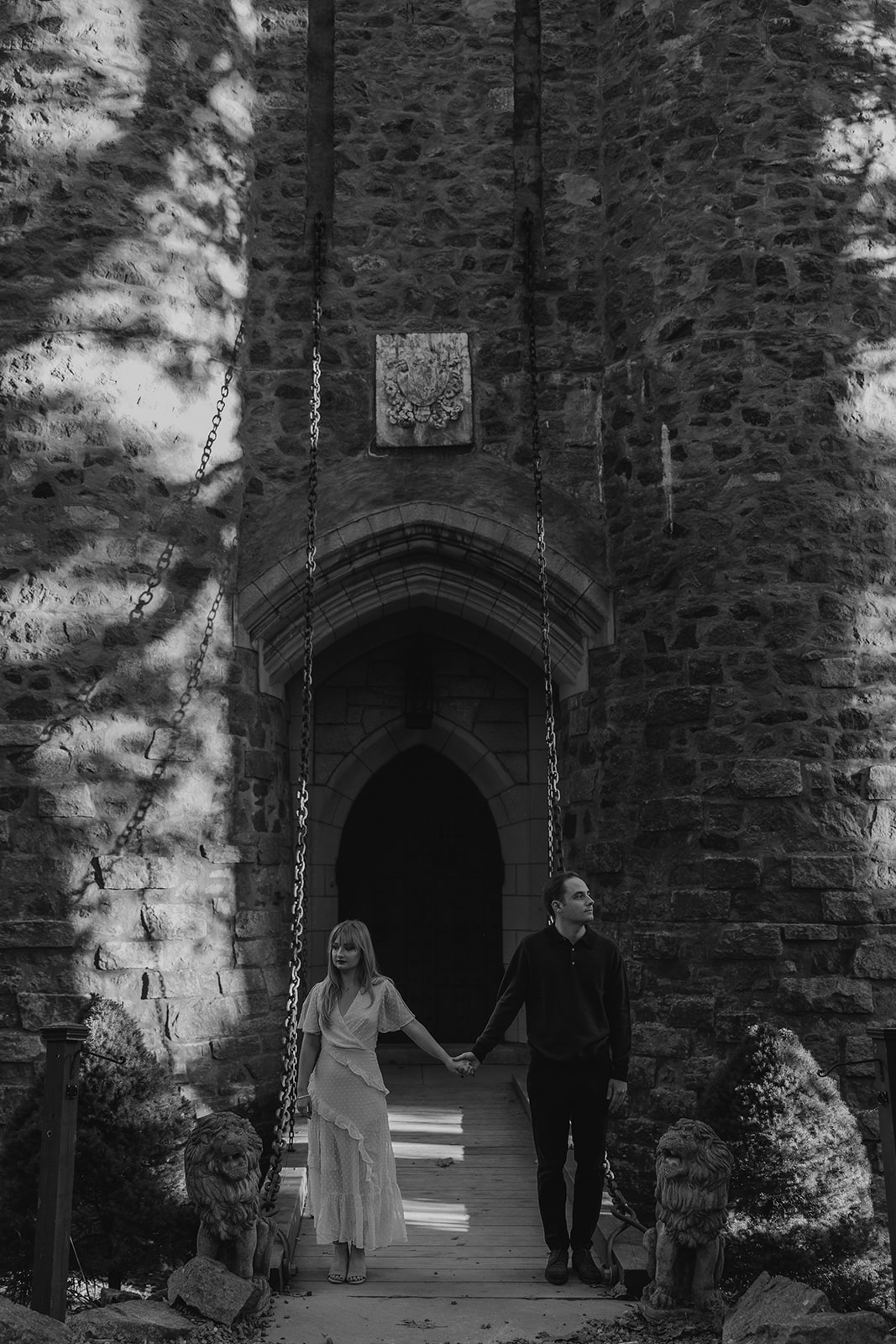 beautiful couple pose outside the Hammond castle during their Massachusetts engagement photoshoot