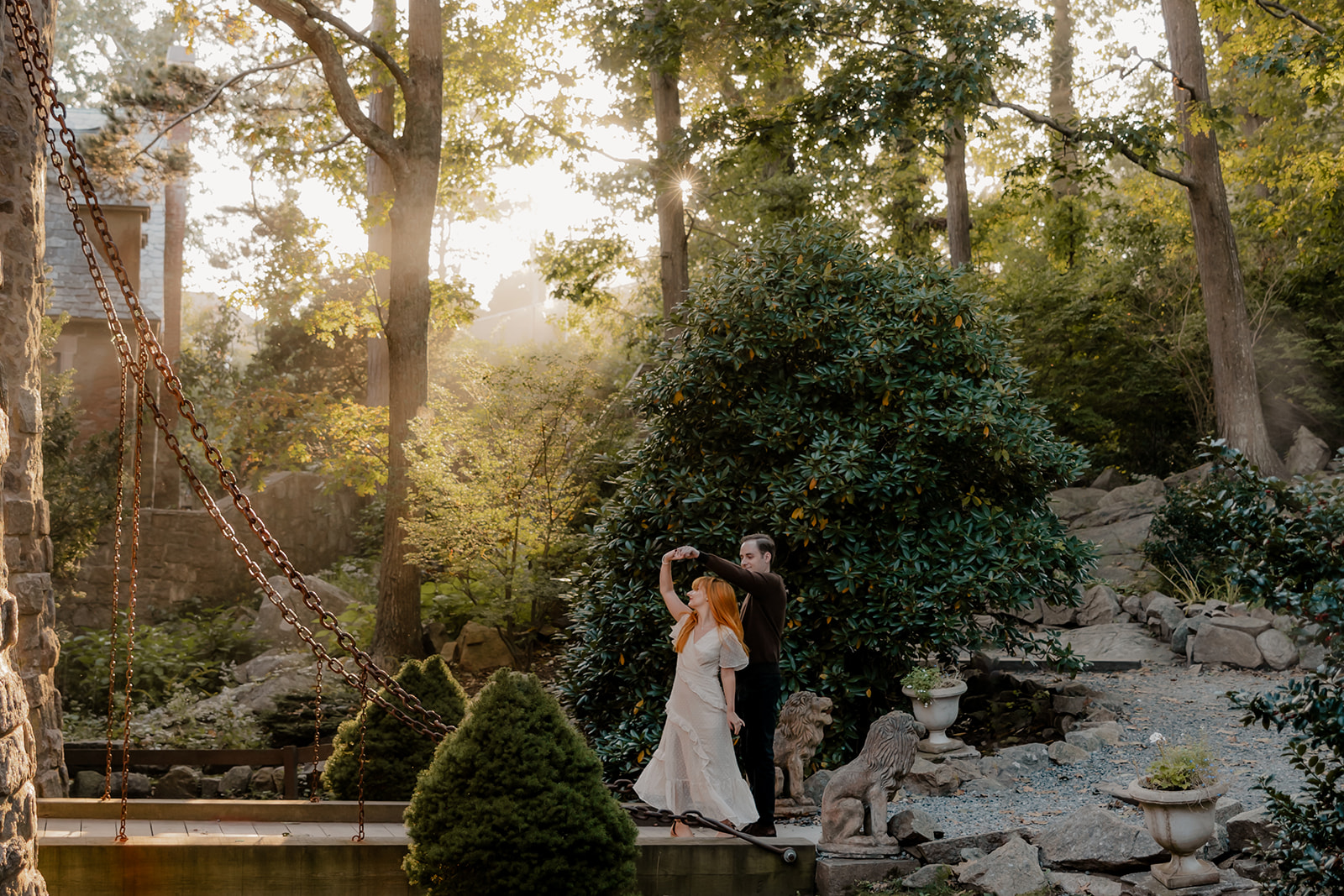 beautiful couple pose outside the Hammond castle during their Massachusetts engagement photoshoot