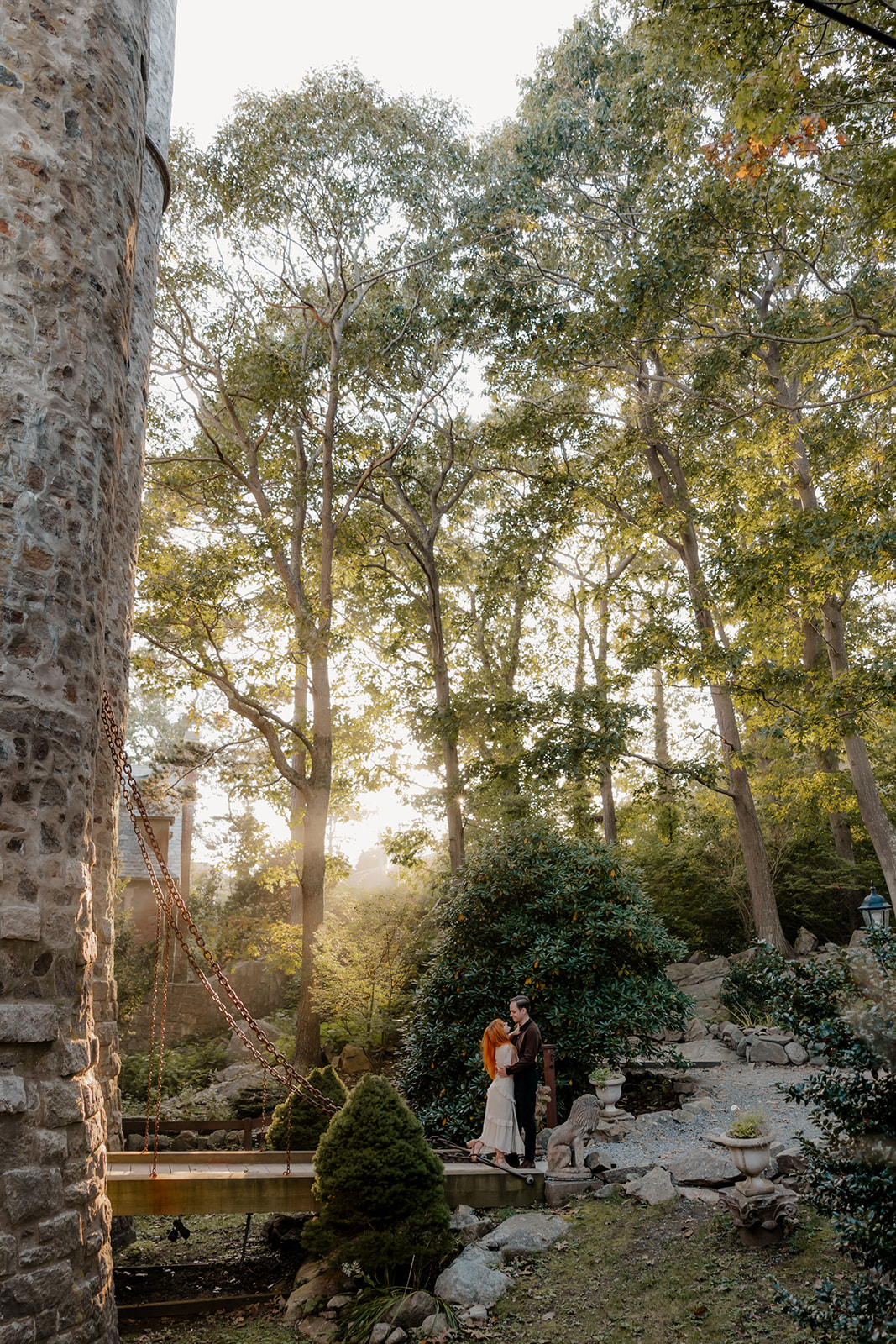 beautiful couple pose outside the Hammond castle during their Massachusetts engagement photoshoot