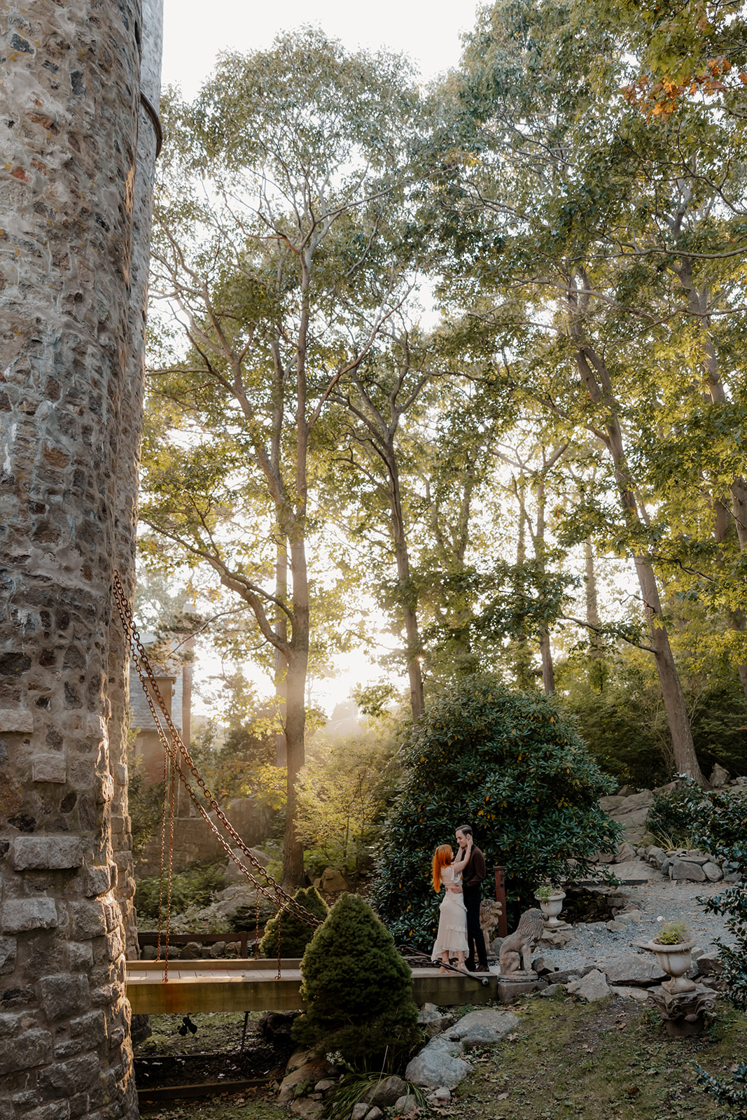 beautiful couple pose outside the Hammond castle during their Massachusetts engagement photoshoot