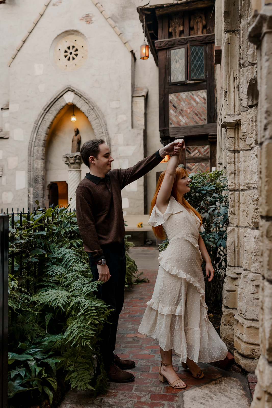 Beautiful couple dance in the garden of Hammond Castle during their New England engagement photos