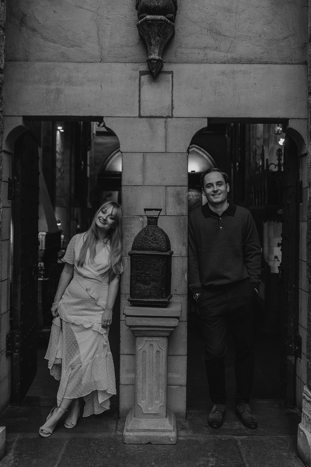 stunning couple pose in the Hammond Castle walkways during their New England engagement photos 