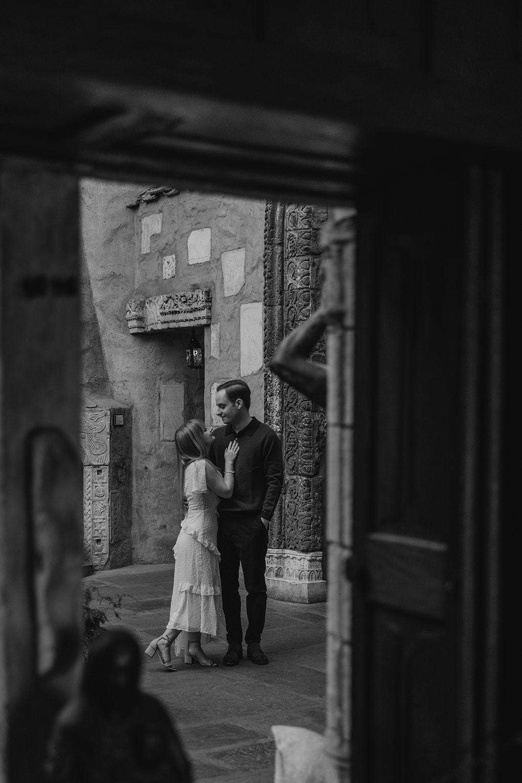 beautiful couple pose outside the Hammond castle during their Massachusetts engagement photoshoot