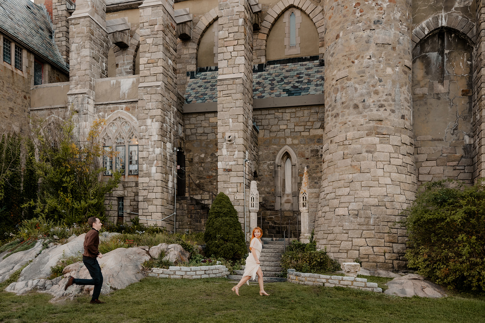 beautiful couple pose outside the Hammond castle during their Massachusetts engagement photoshoot