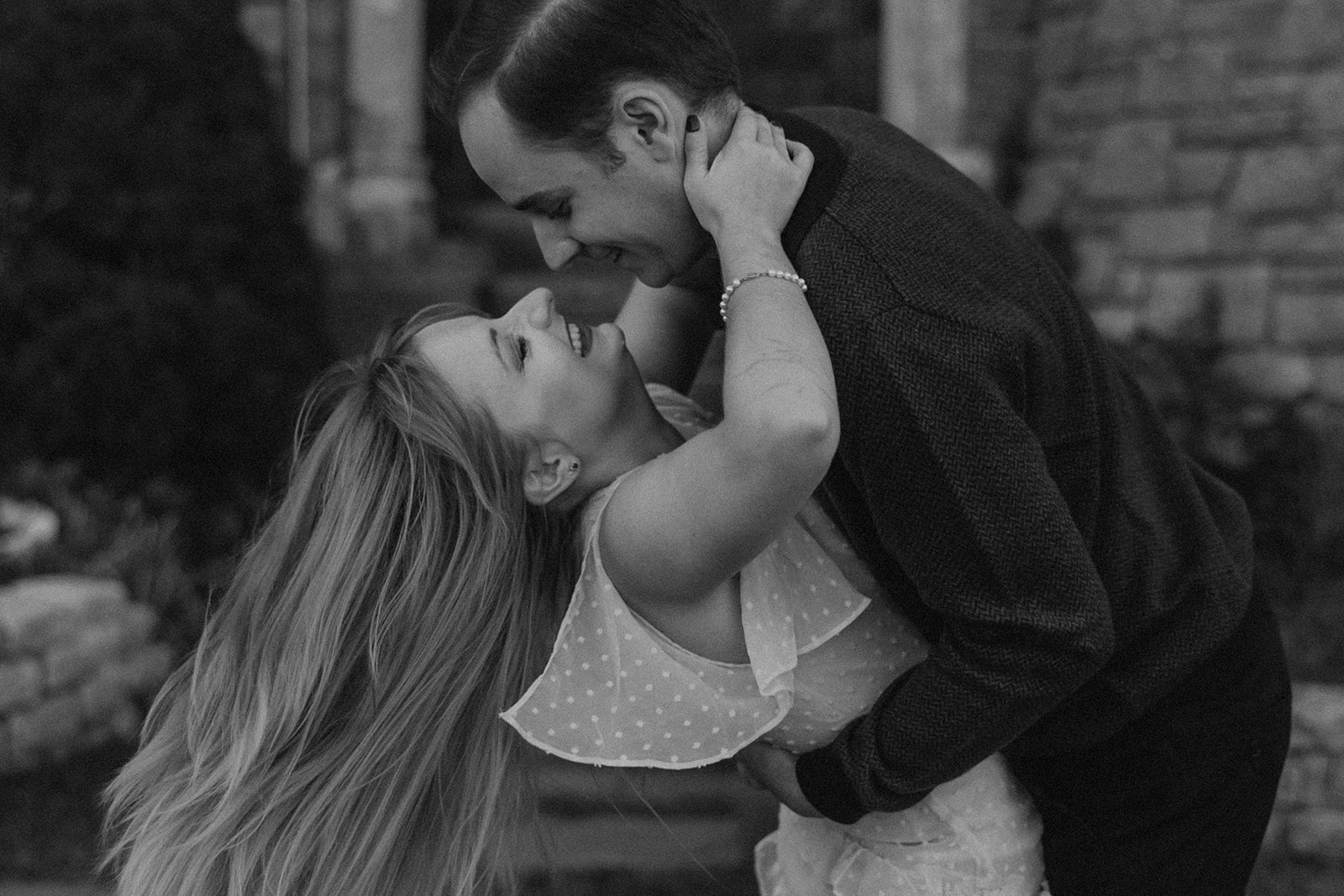 couple share a kiss together during their Massachusetts engagement photos 