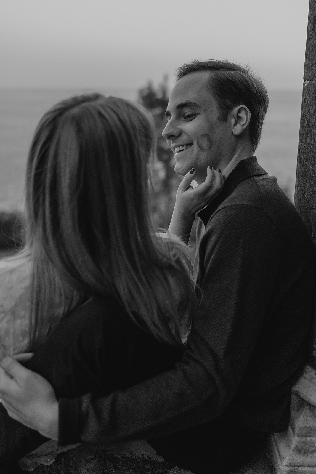 couple share a kiss together during their Massachusetts engagement photos 