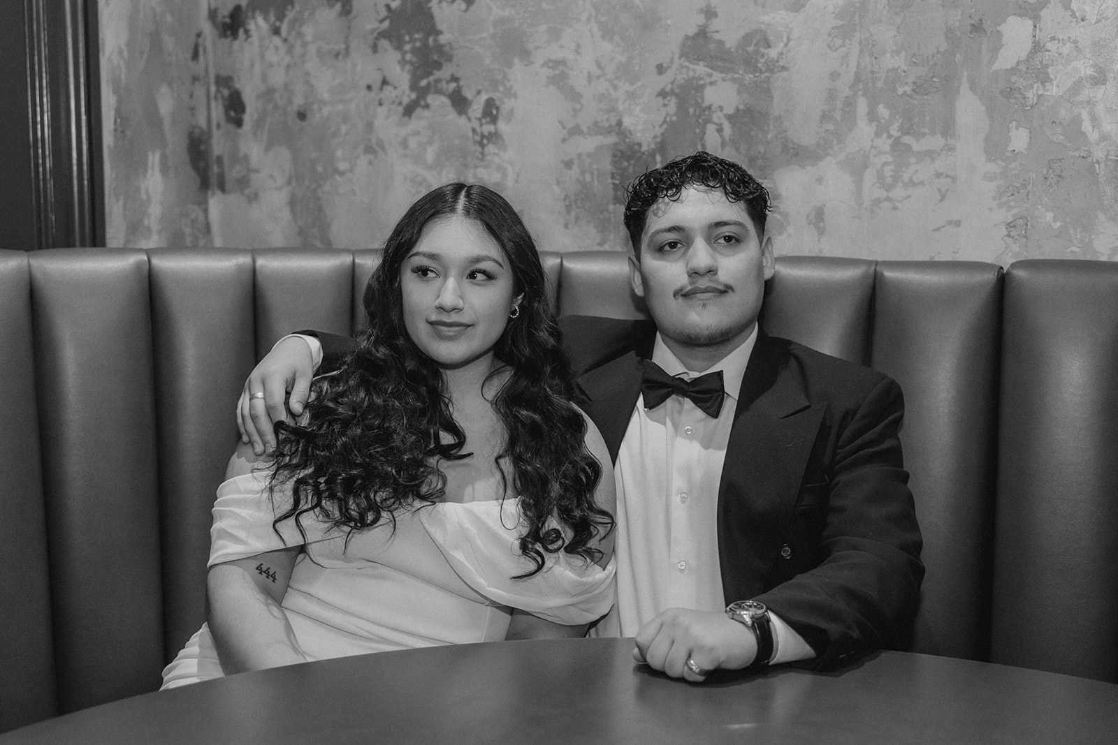 beautiful couple pose together in a Boston restaurant