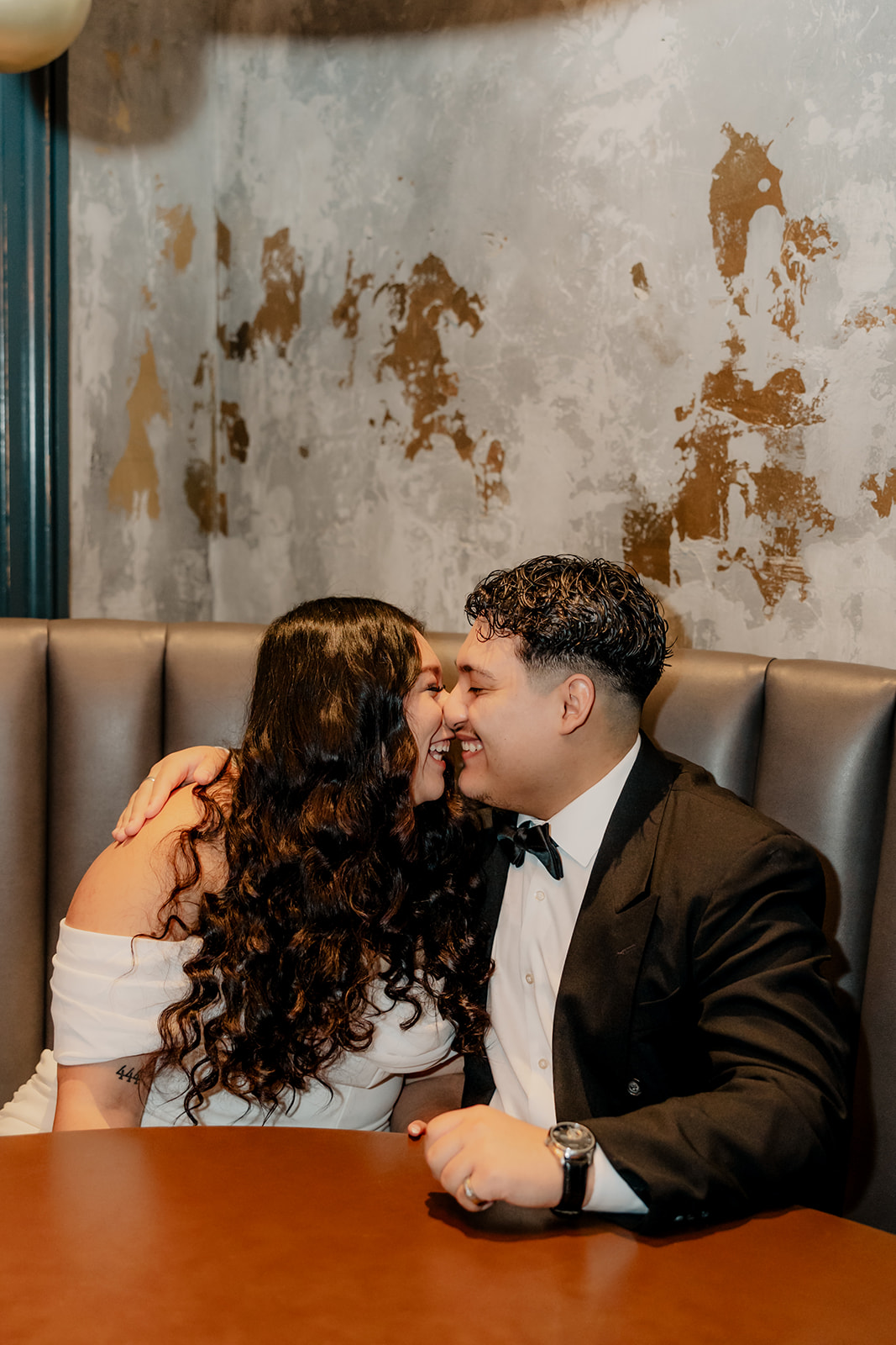 stunning couple pose in a Boston bar