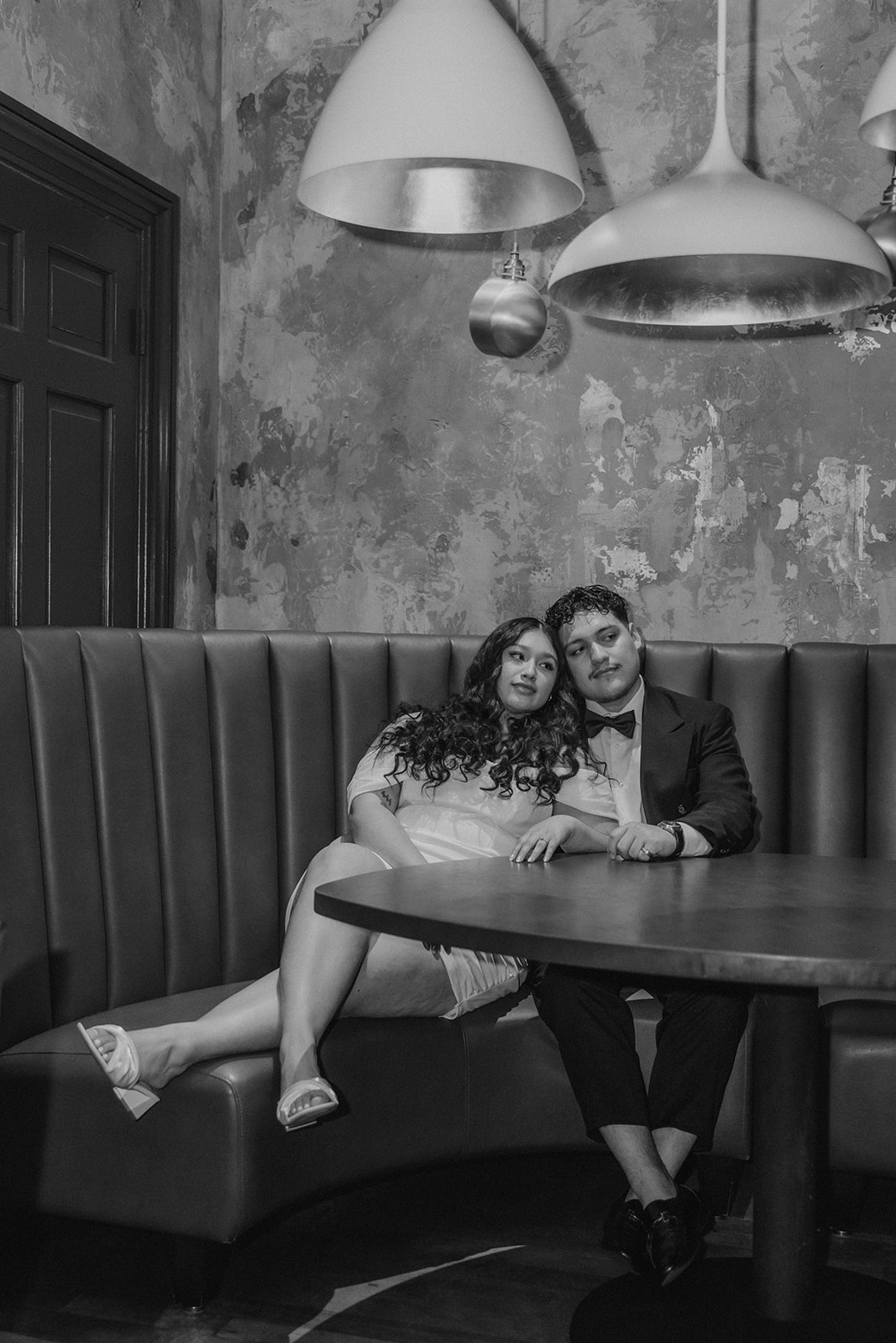 beautiful couple pose together in a Boston restaurant