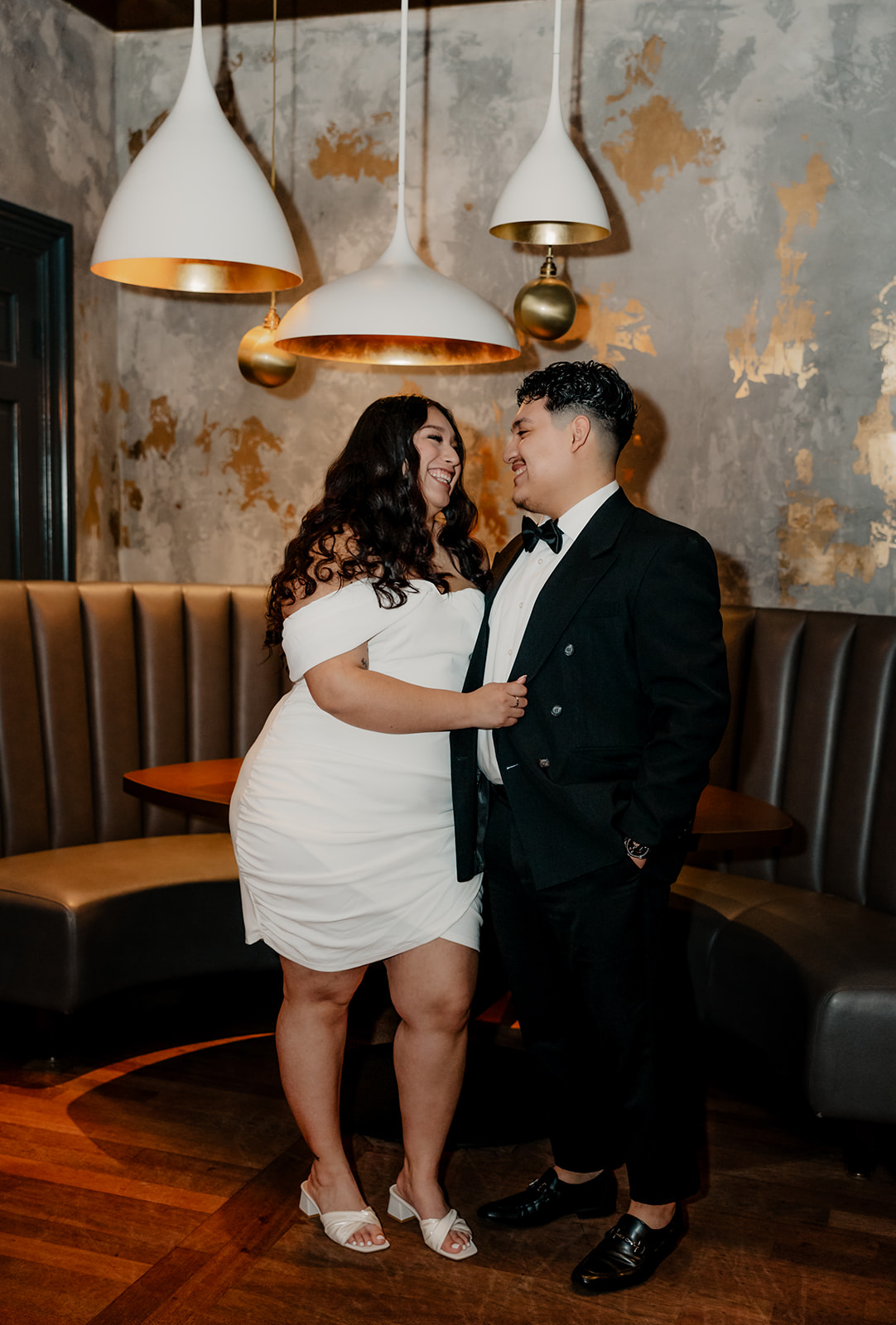 stunning couple pose in a Boston bar