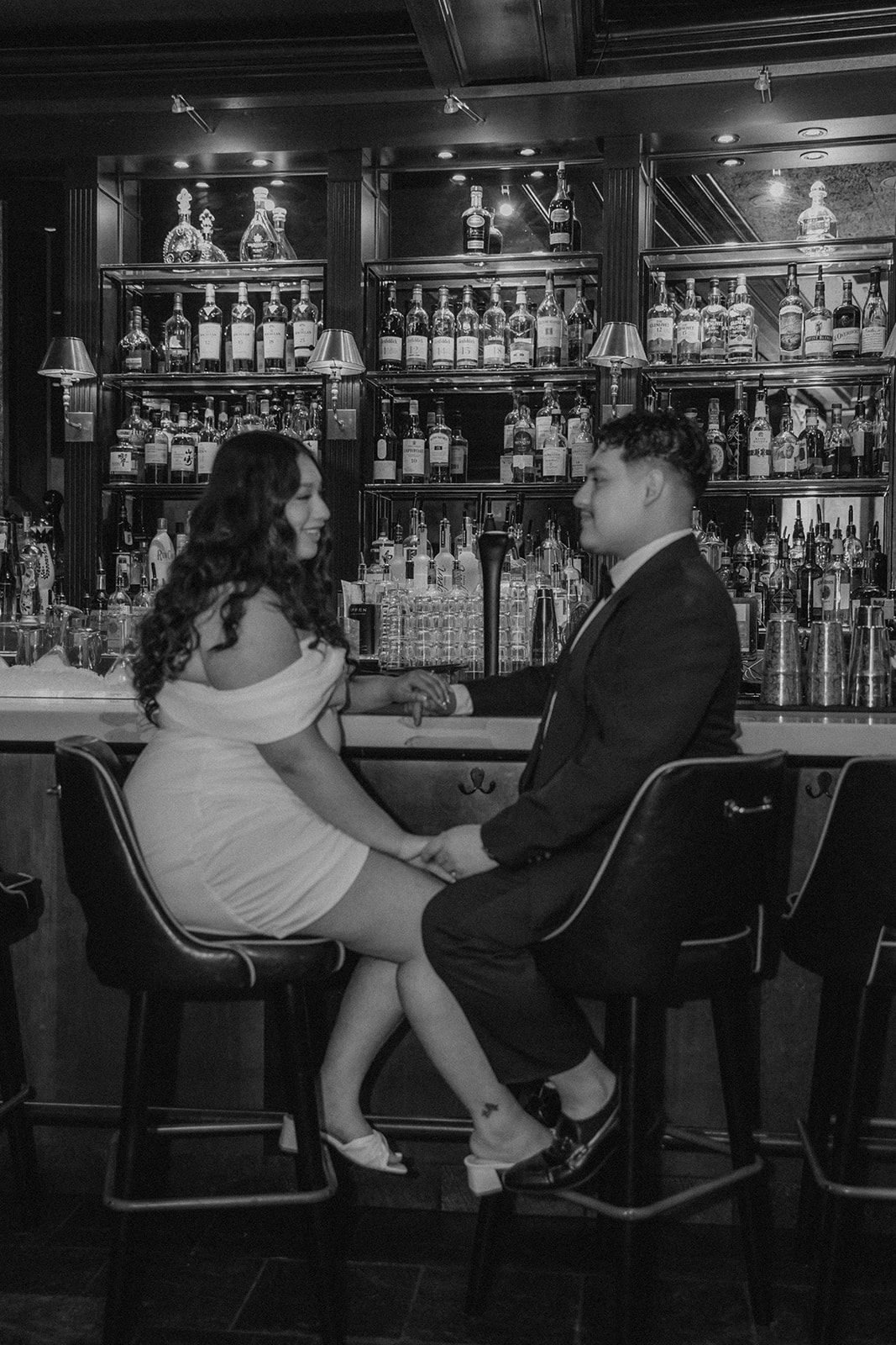 stunning couple pose in a Boston bar