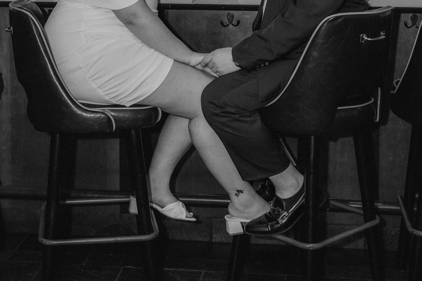 beautiful couple pose together in a Boston restaurant