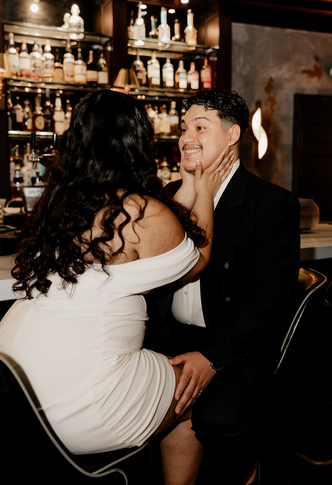 stunning couple pose in a Boston bar