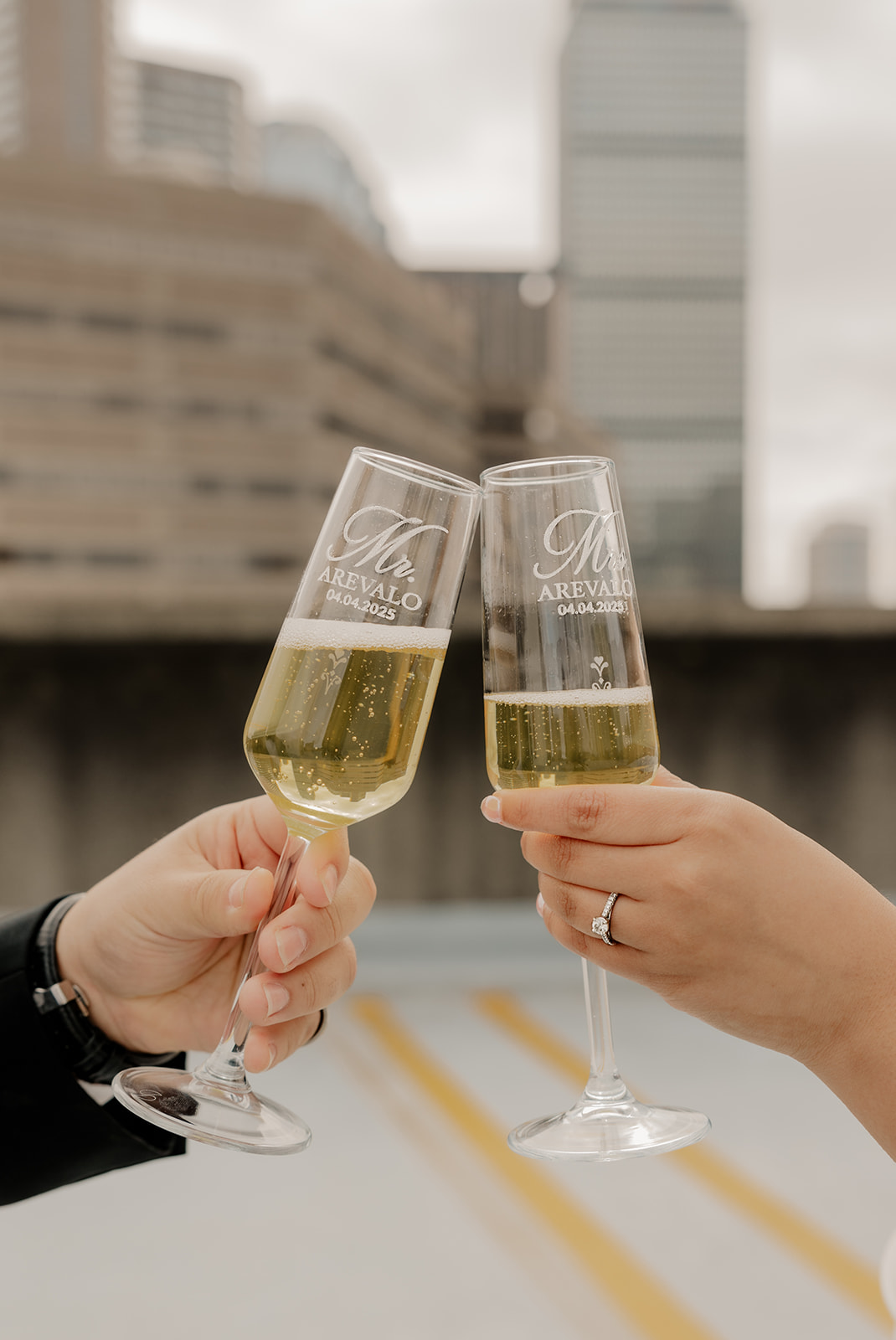 couple share champagne during their Boston engagement photoshoot