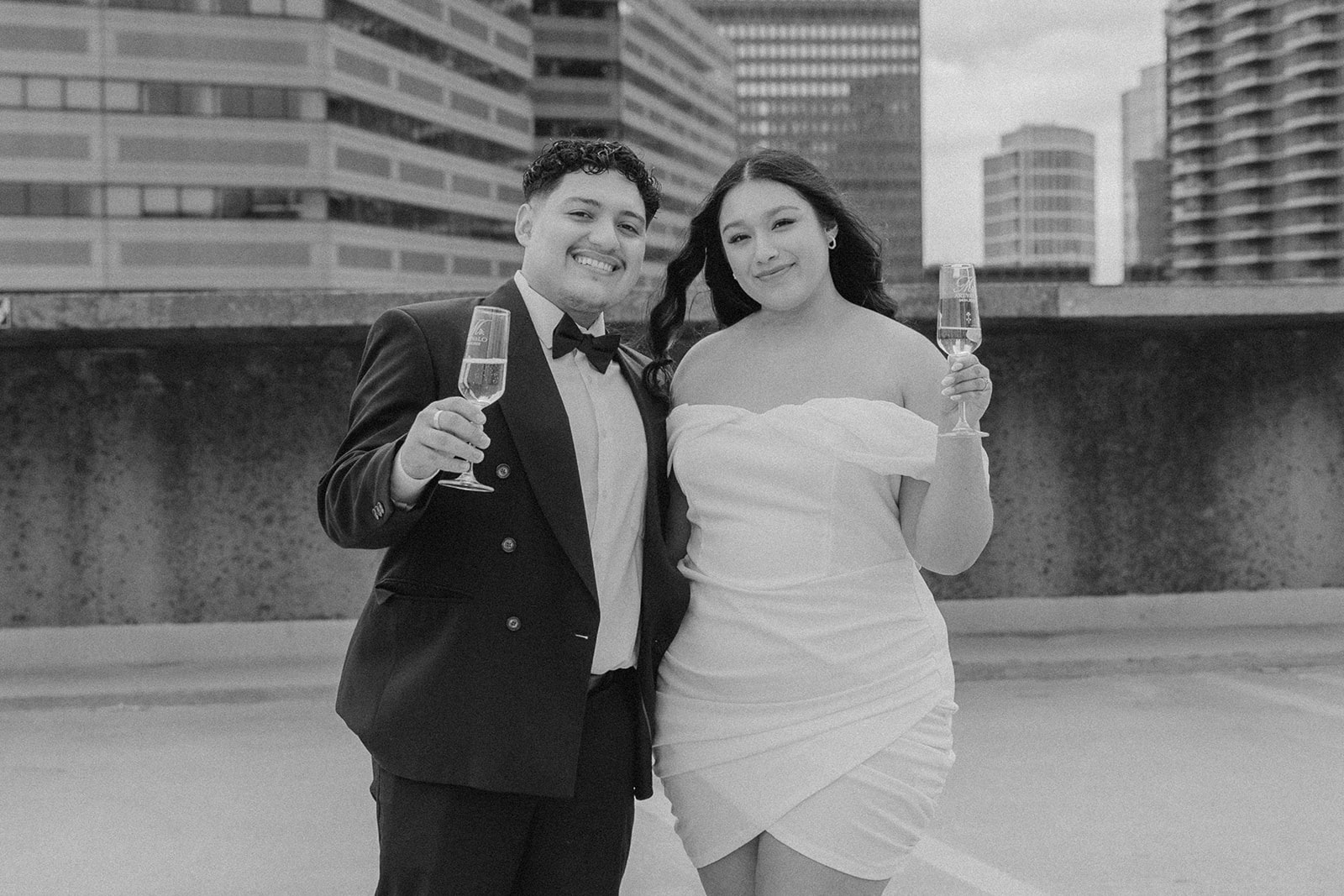 stunning couple pose with their champagne during their Boston engagement photoshoot