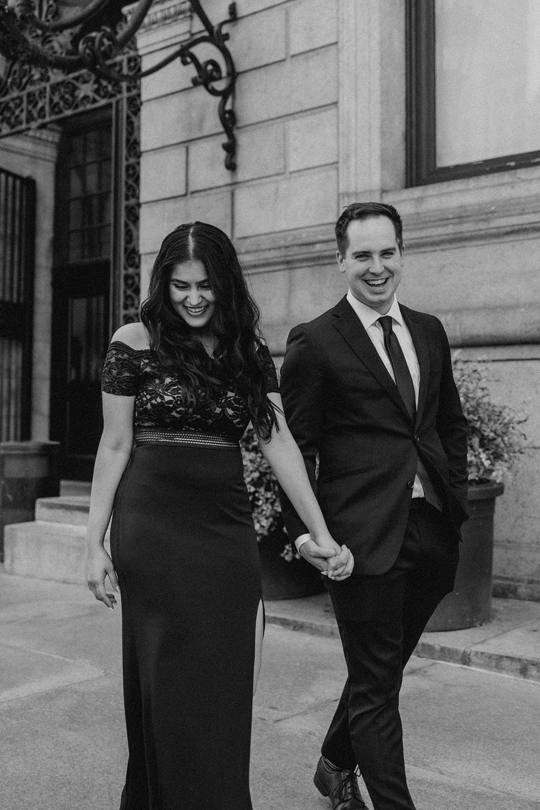 beautiful couple walk together in Boston during their dreamy engagement photoshoot