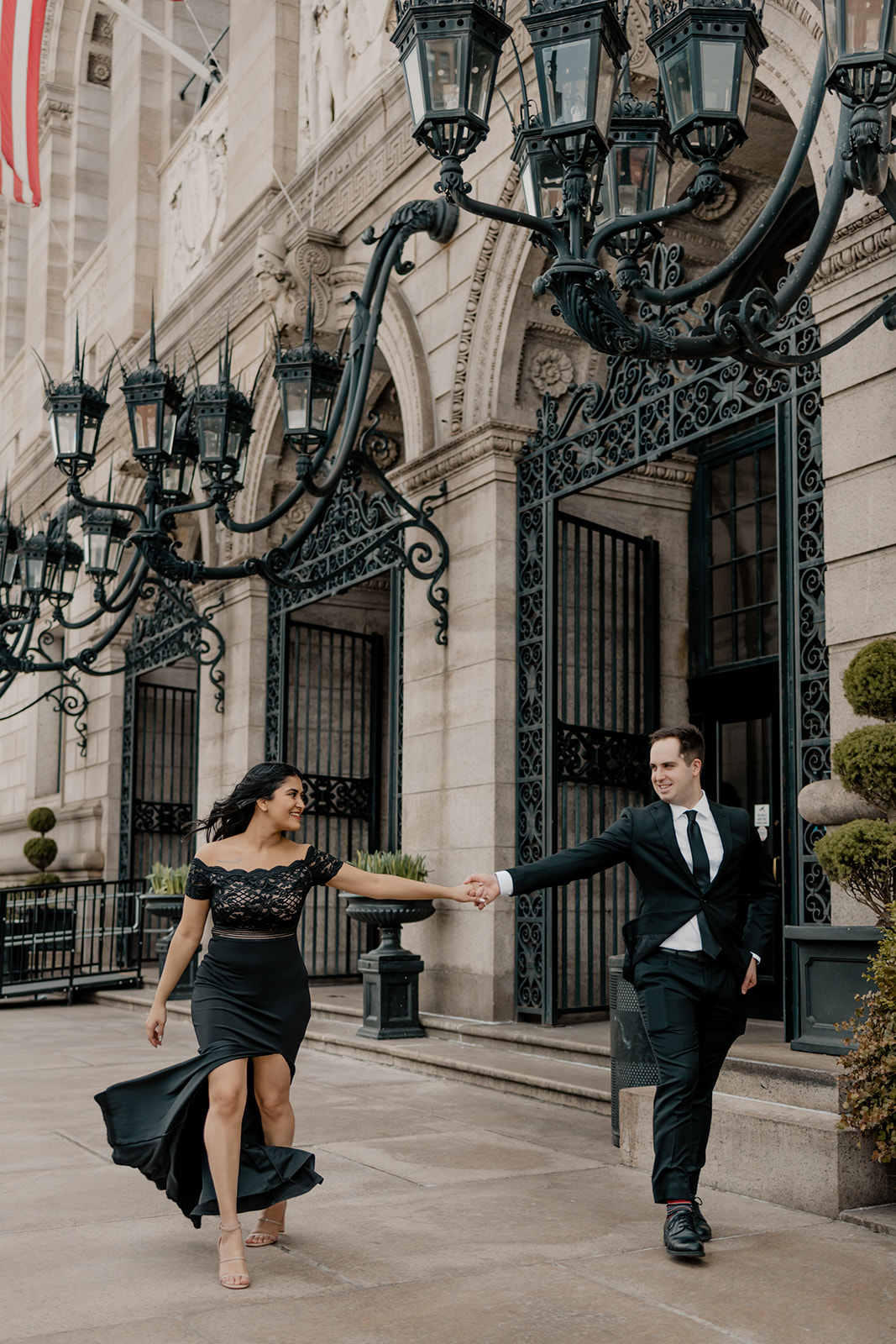 beautiful couple walk together in Boston during their dreamy engagement photoshoot