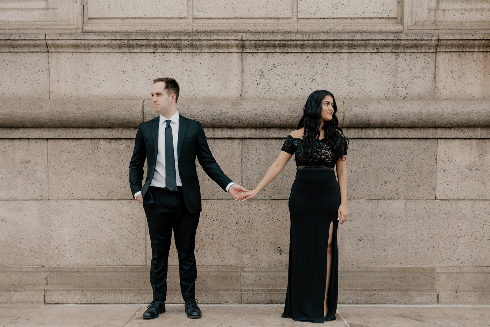 Beautiful couple pose outside the Boston public library 