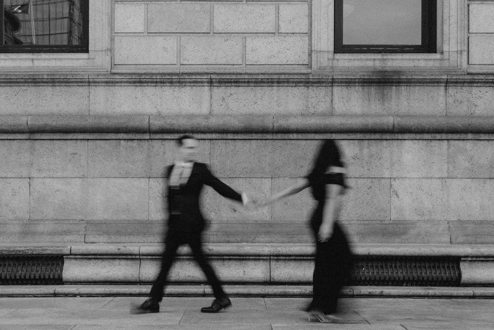 beautiful couple walk together in Boston during their dreamy engagement photoshoot