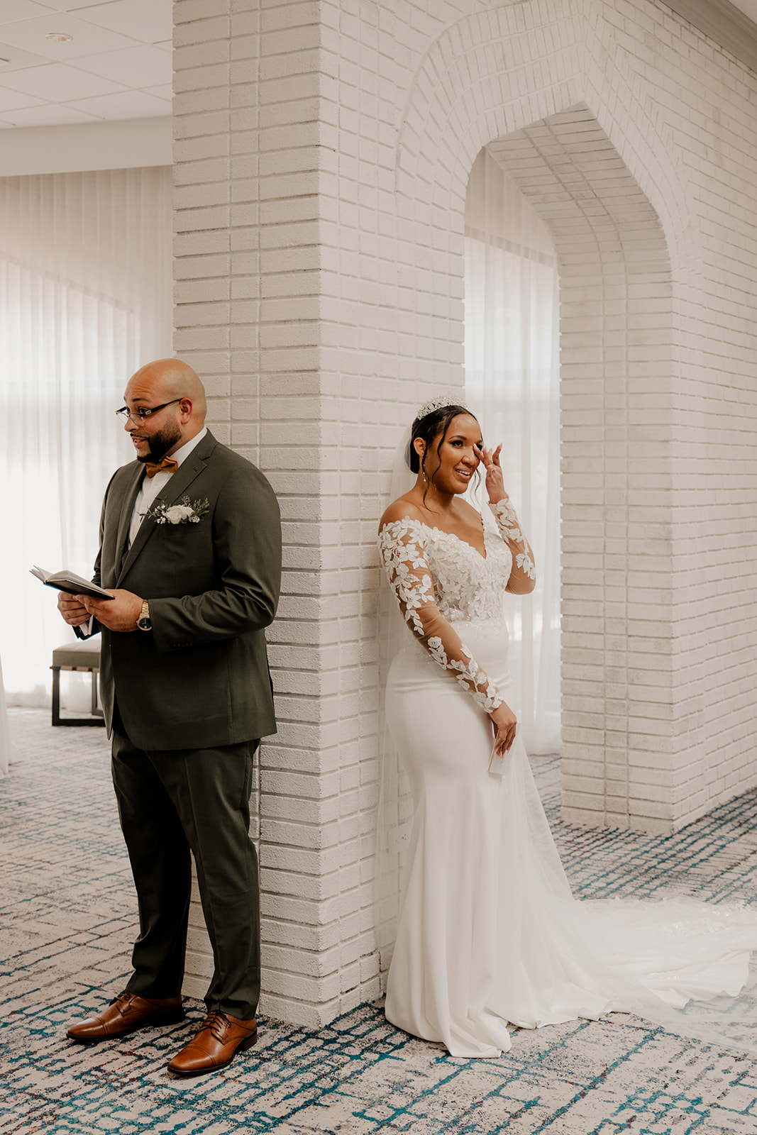 beautiful couple do a private vow and first touch ceremony around a corner 